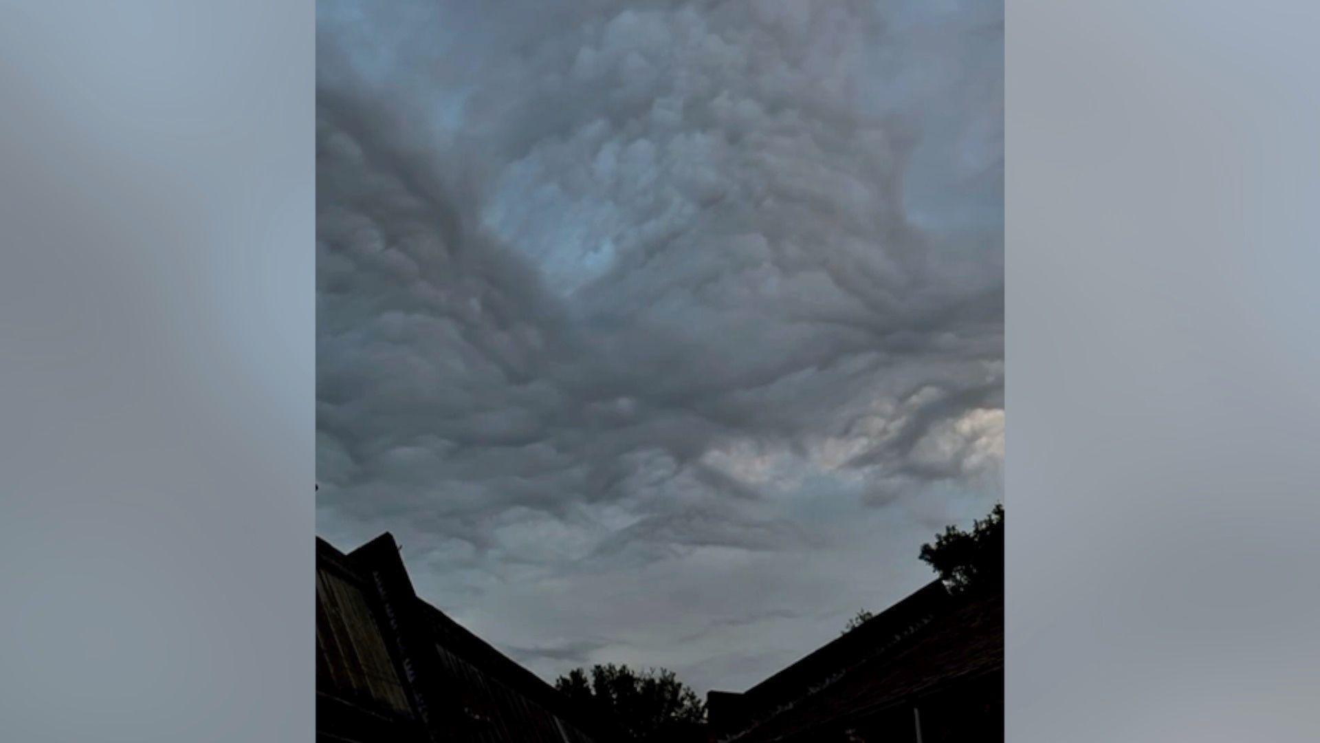 Image of thick, high cloud over rooftops