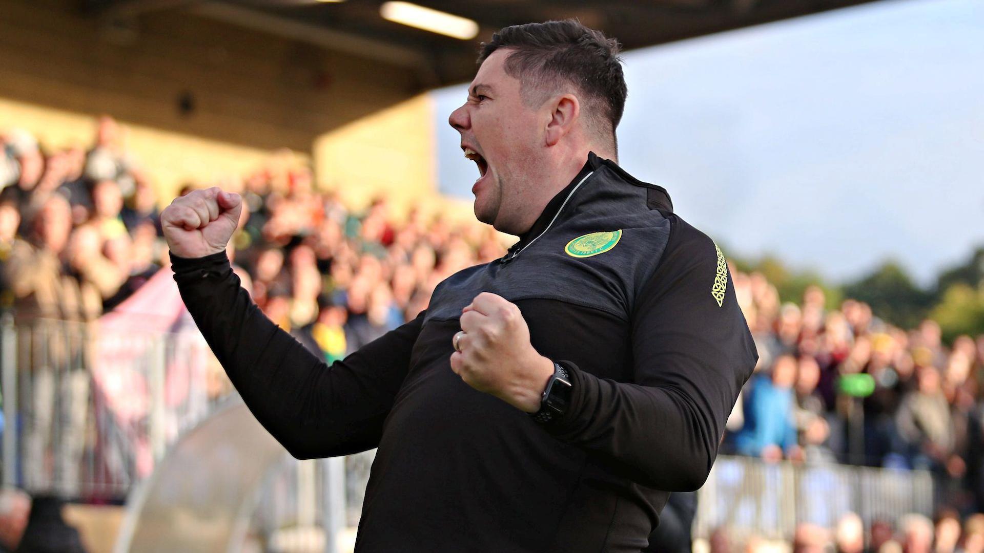 Caernarfon Town boss Richard Davies celebrates his side's win