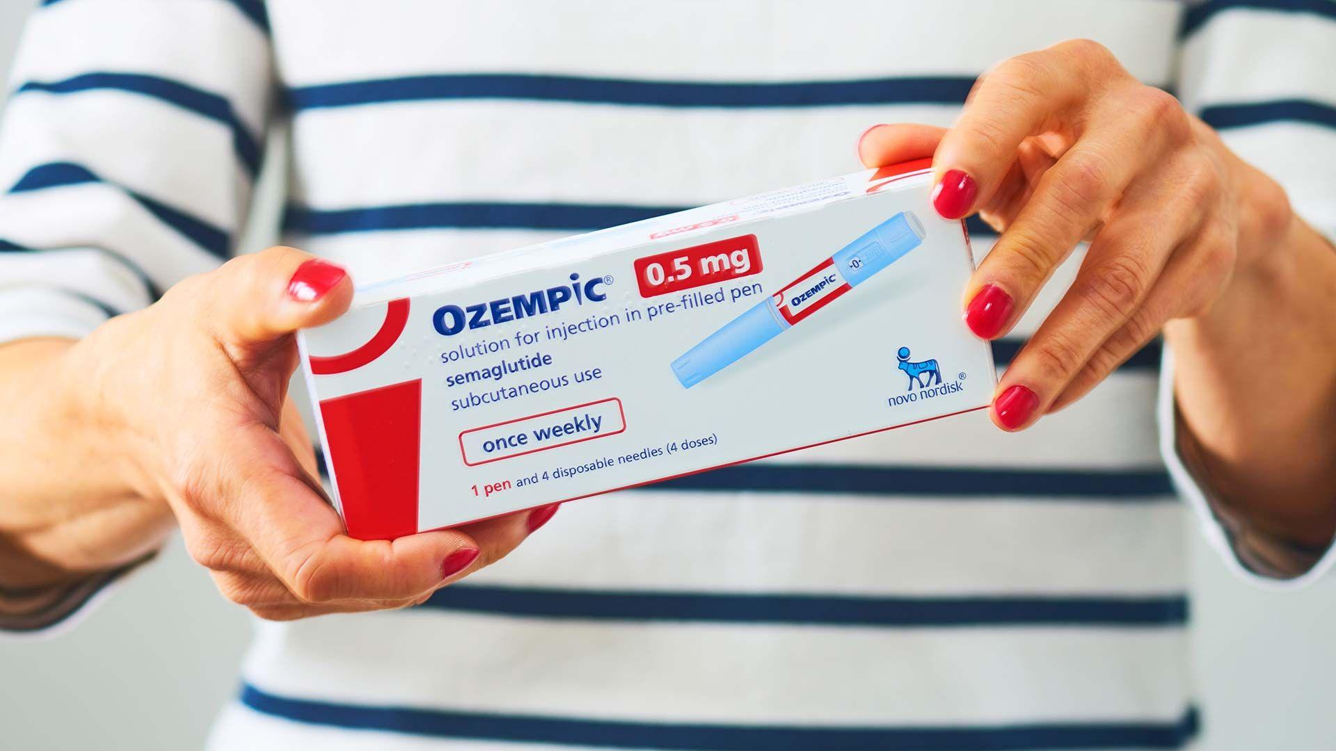 A photo illustration of a box containing an Ozempic injection pen