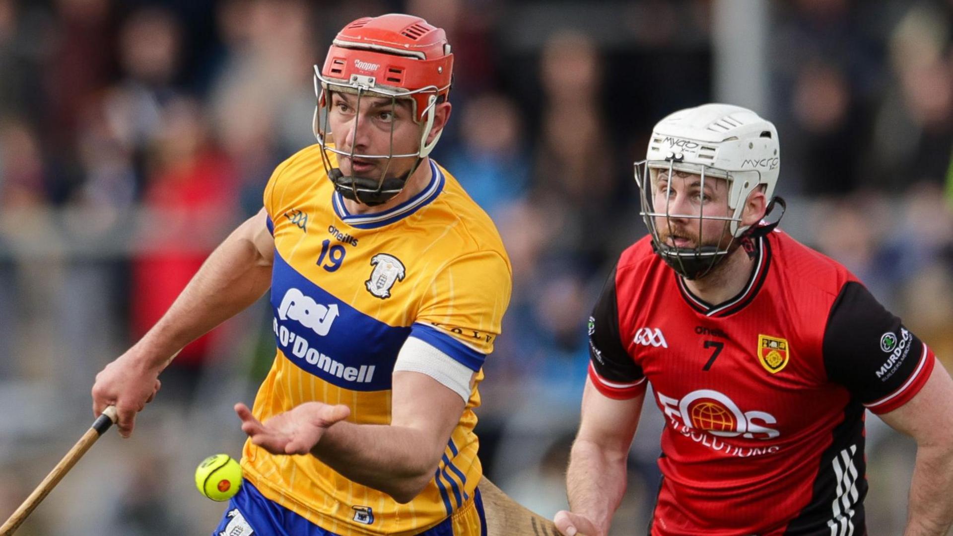 Clare's Peter Duggan with Down's Barry Trainor 