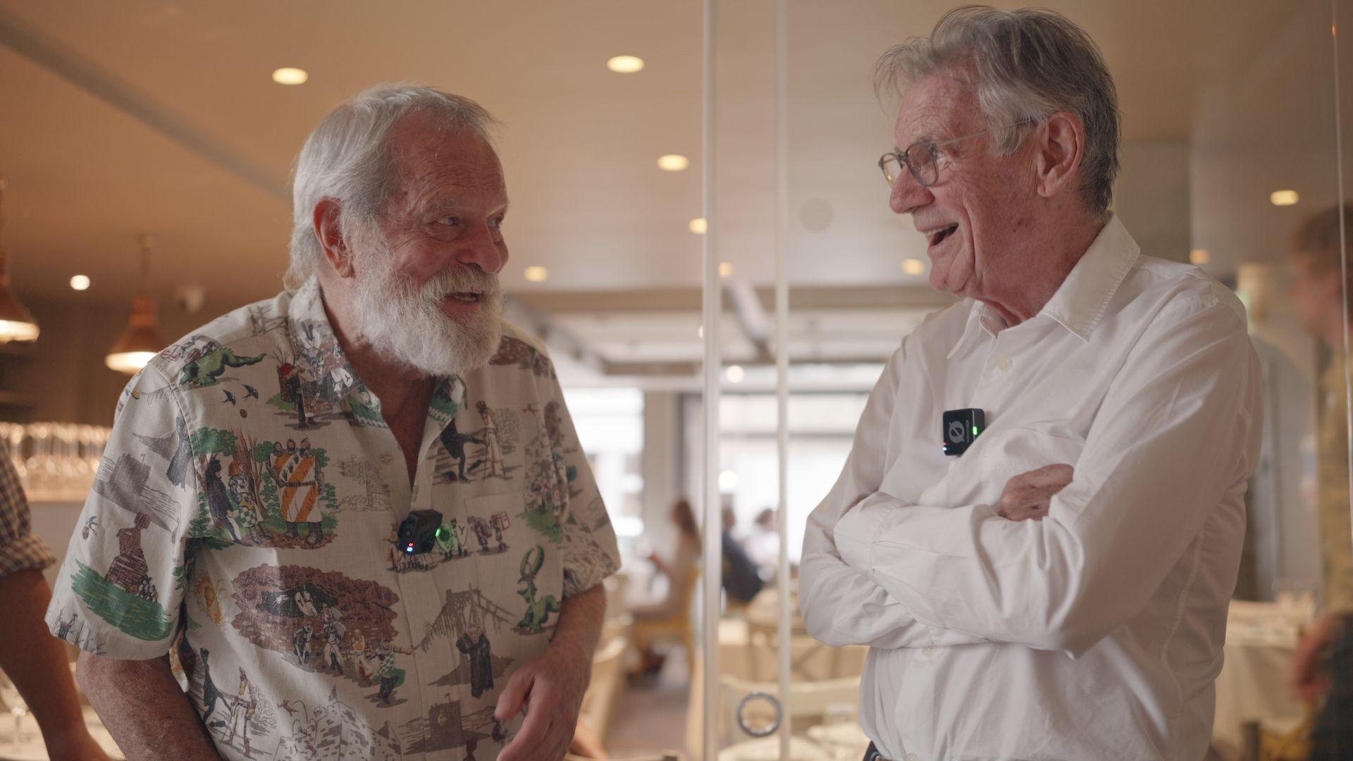 Monty Python stars Terry Gilliam and Michael Palin chat and smile during a visit to the workshop of sculptor Nick Elphick