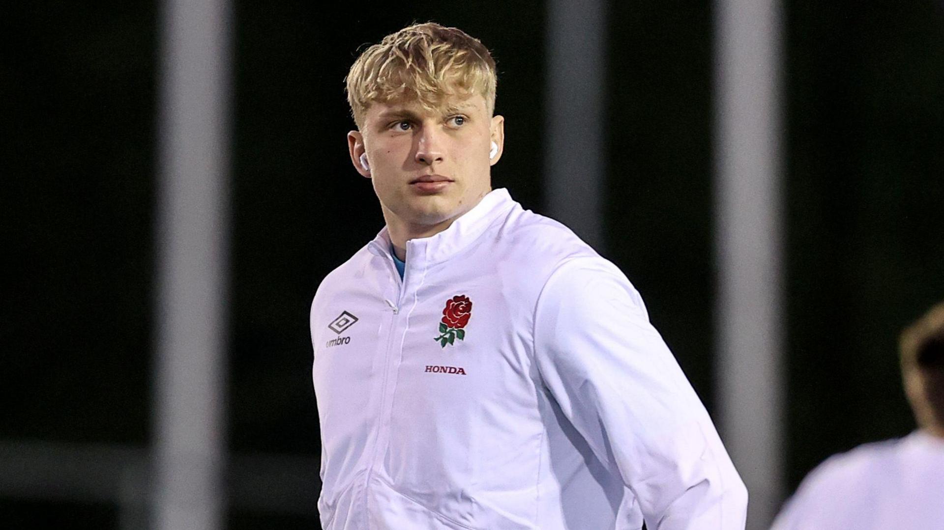 Danny Eite standing on a pitch wearing England kit in 2023