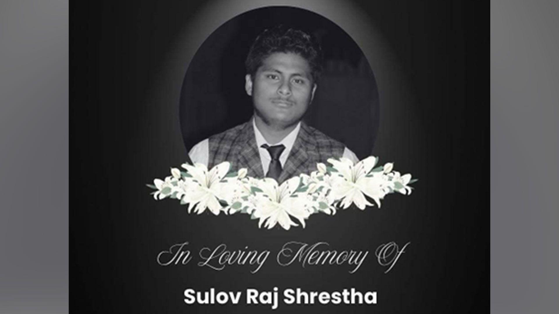 A black and white picture of Sulov Raj Shrestha, with flowers and writing saying 'in loving memory of' superimposed over the image