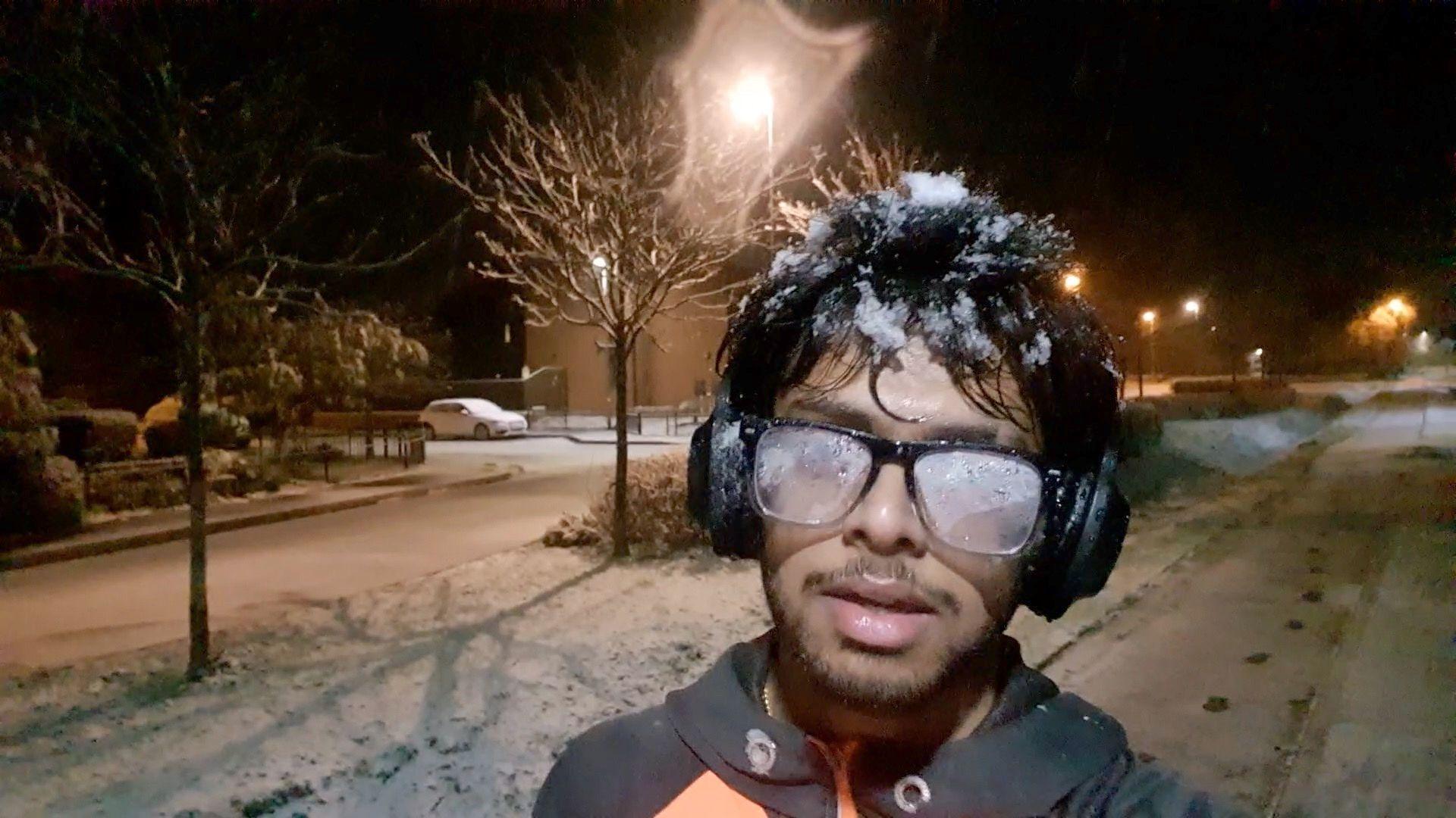 Mridul running in snowy conditions with ice on head and fogged up glasses