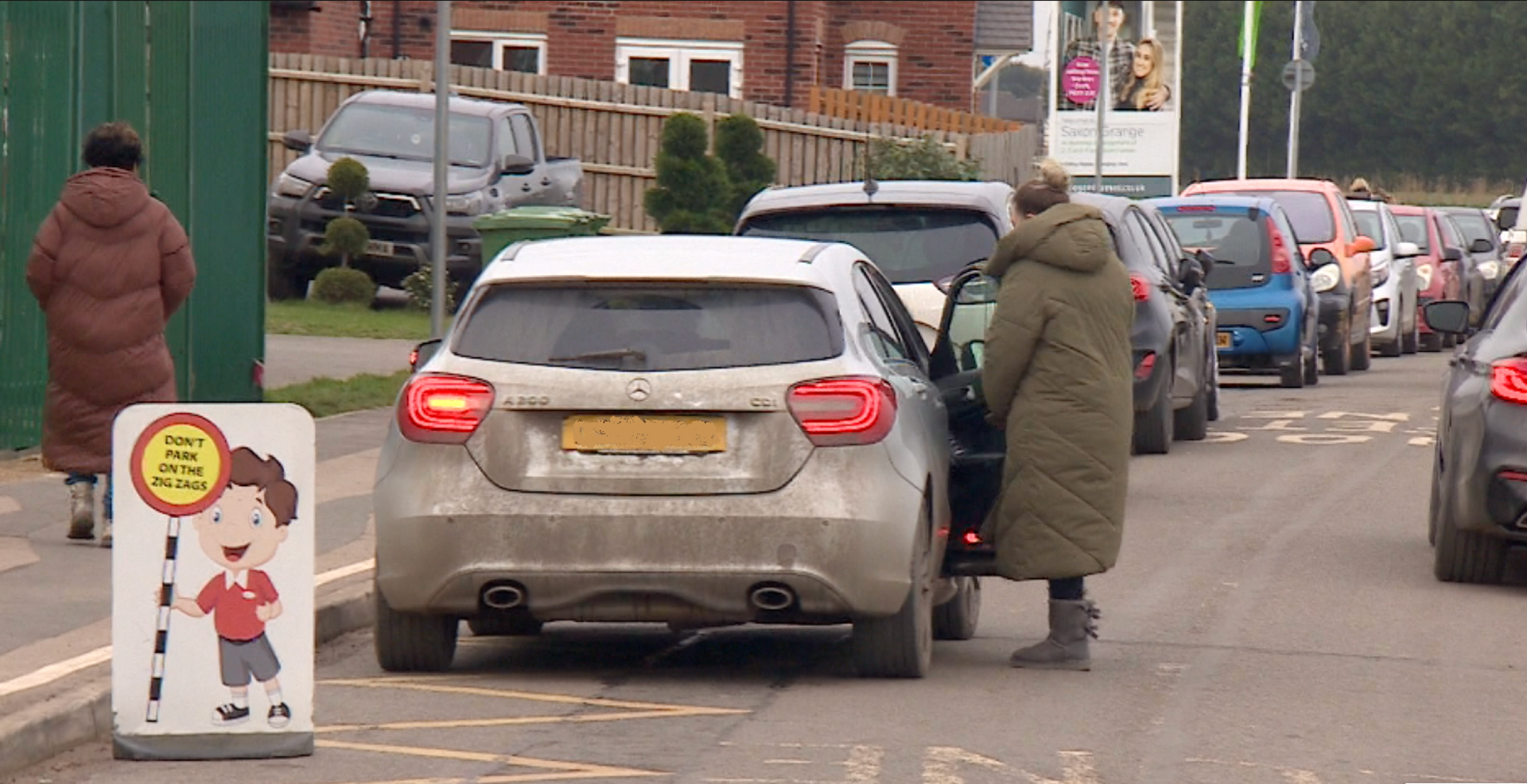 car parked on yellow zigzag lines