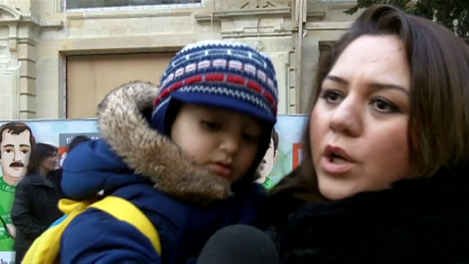 An Azeri woman with her child