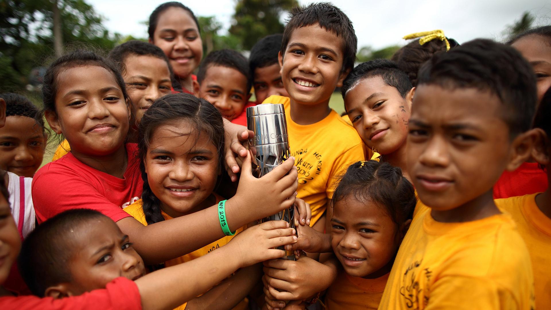 Queen's baton held by children in Tonga