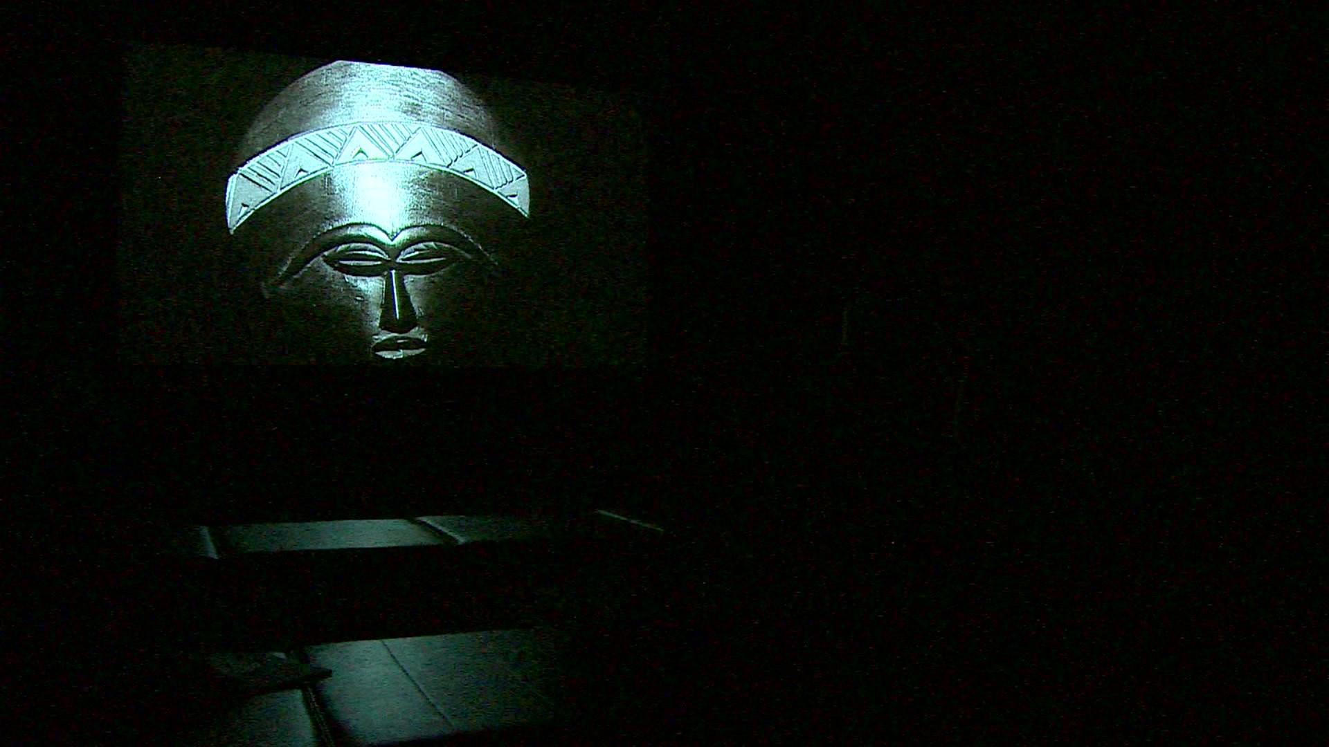 Still from Duncan Campbell's video showing an African mask