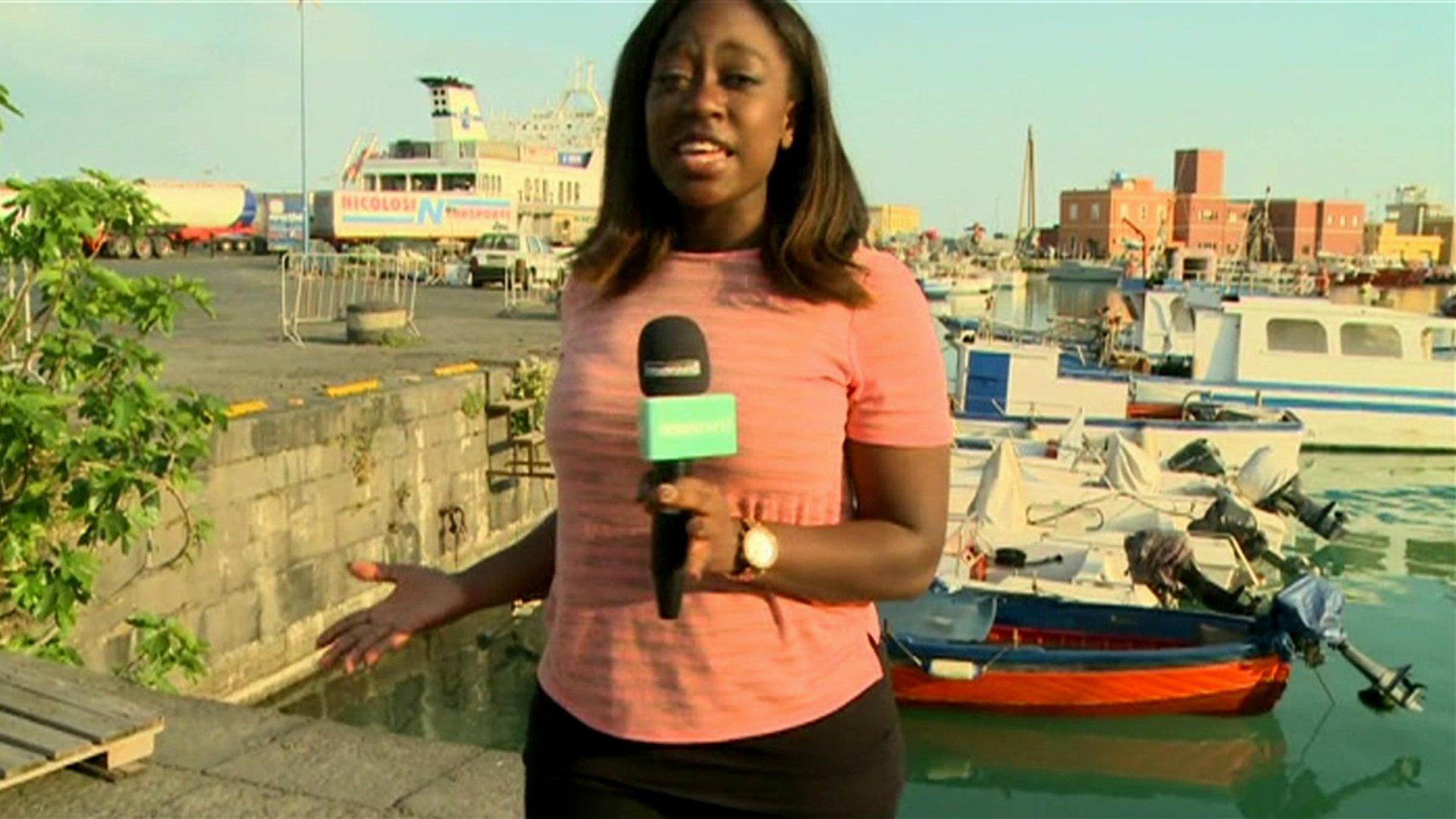 Ayshah at a harbour in Sicily.