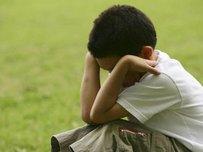 Actor posing as depressed boy