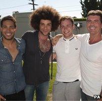 Simon Cowell and his three finalists