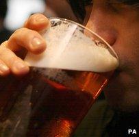 Man drinking pint