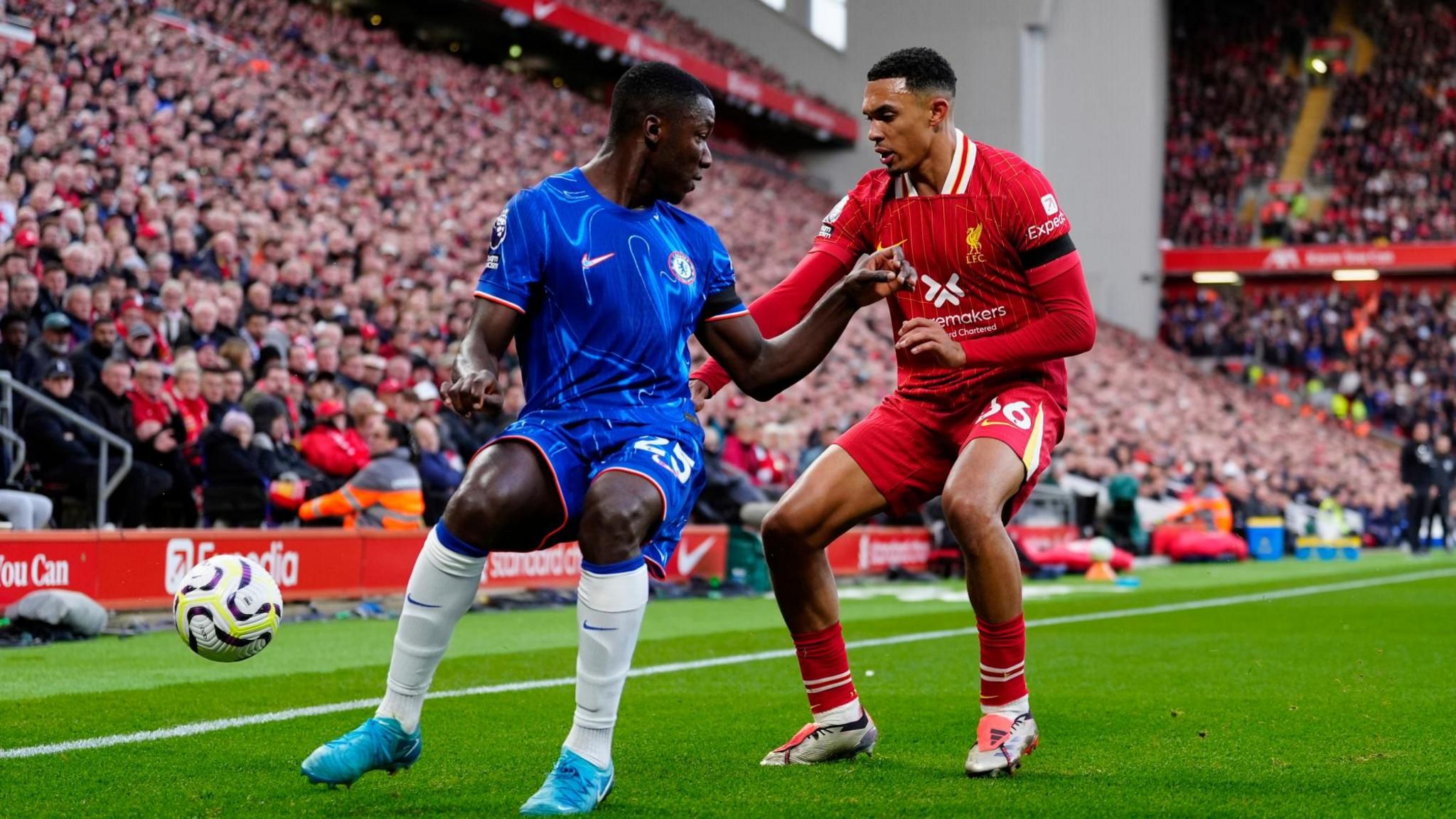 Chelsea’s Moises Caicedo shields the ball from Liverpool's Trent Alexander Arnold near the touchline at Anfield.