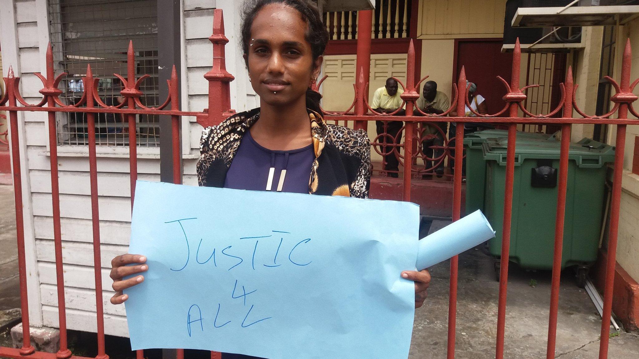 Transgender activist Twinkle Bissoon protests outside Georgetown Magistrates Court on 10 March 2017