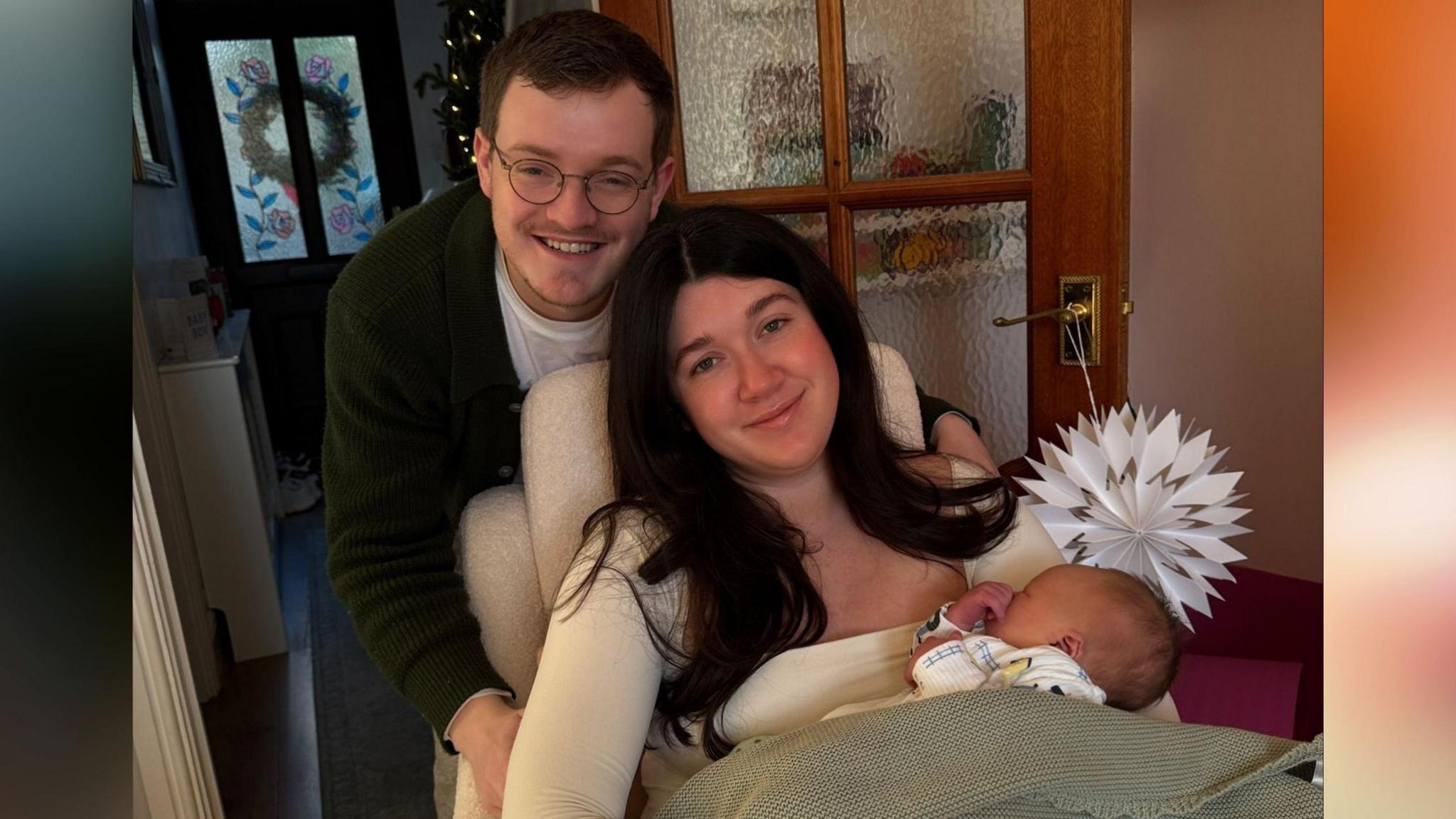 Brooke Webb a Wiliam Rees, y ddau yn 27 oed, gyda'u mab bach Gwilym Ioan Rees-Webb.