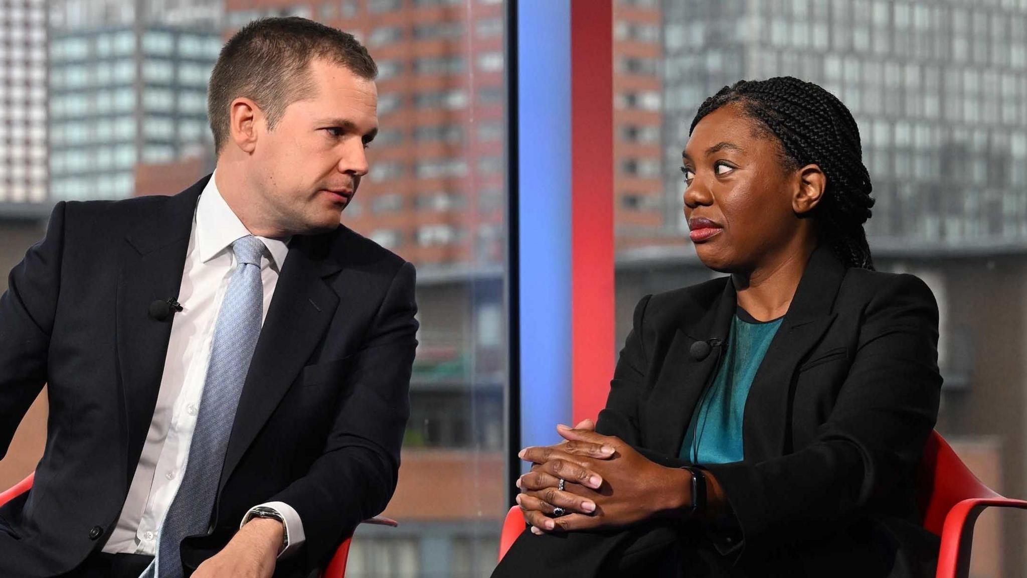 Conservative Party leadership contenders Robert Jenrick and Kemi Badenoch speak to each other while seated on the set of Sunday with Laura Kuenssberg.