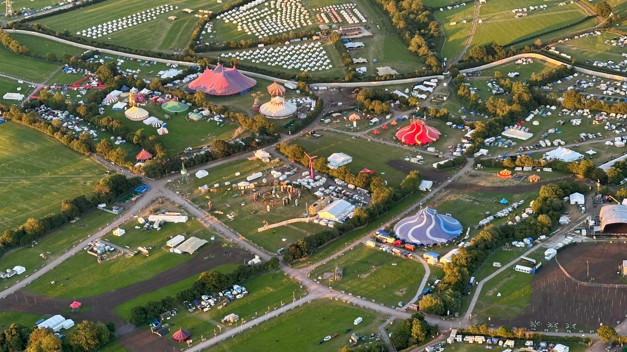 Aerial view of Worthy Farm. Tents and stages can be seen. 