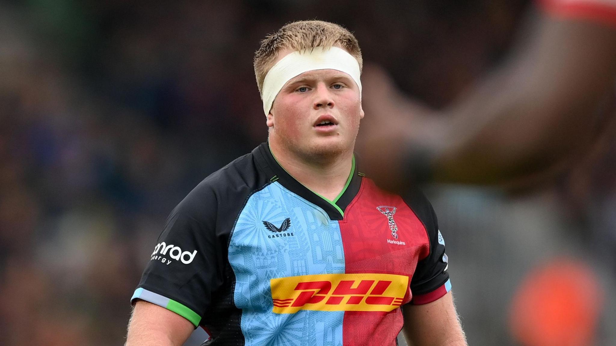 Fin Baxter standing on the field during a match