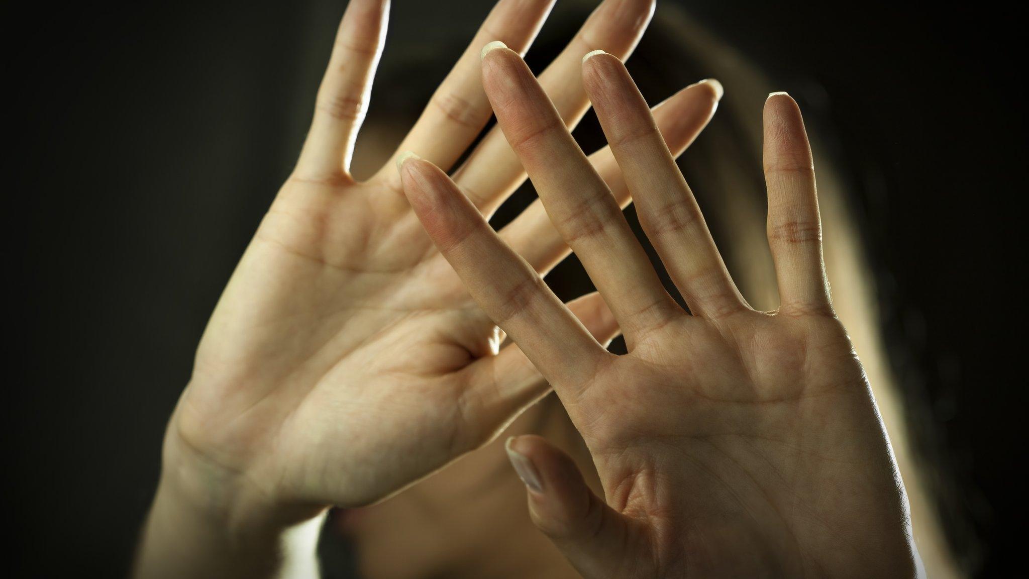 Stock image of woman defending herself from attack