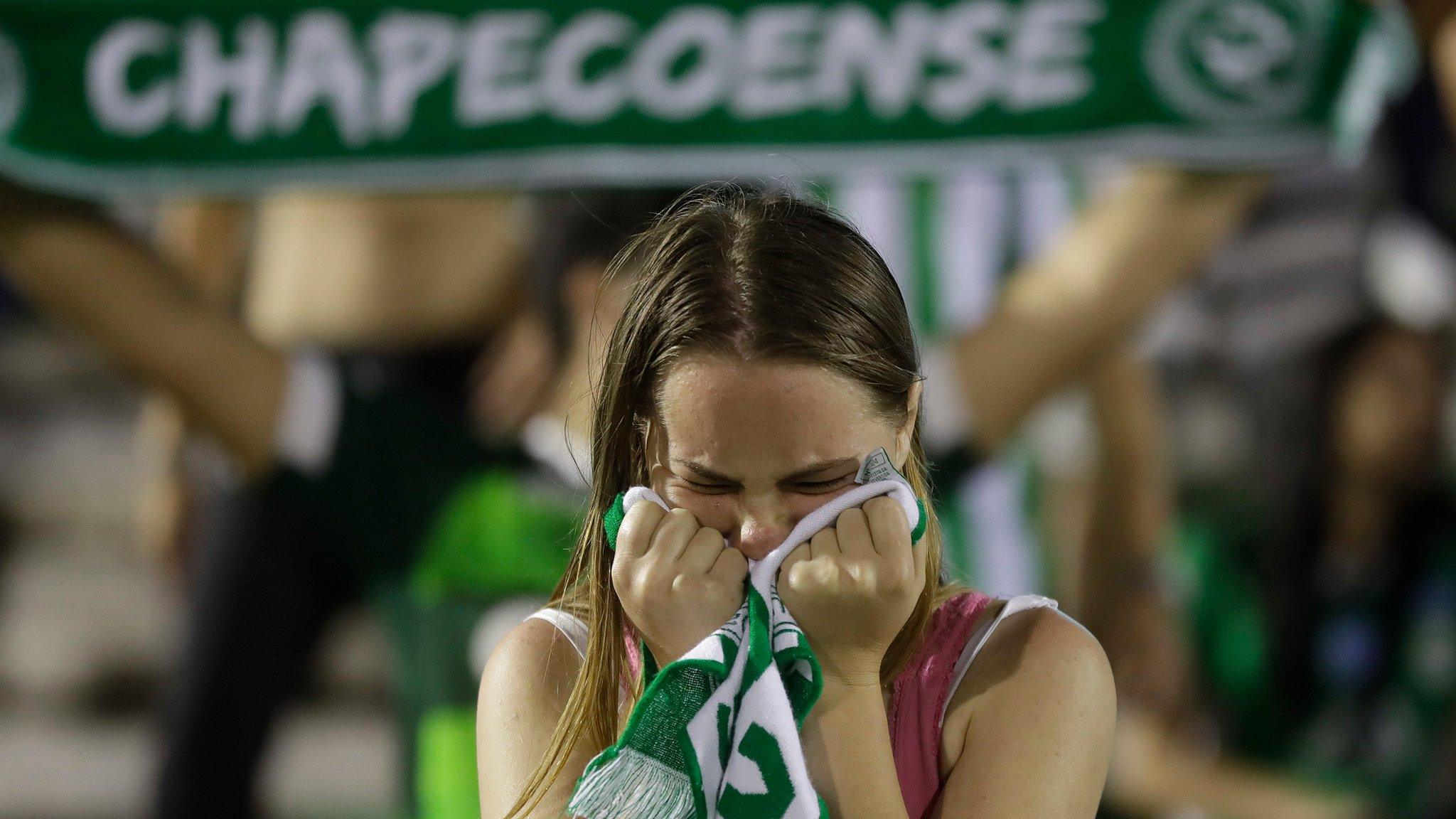 Fan mourns at Arena Conda stadium in Chapeco, Brazil, on 29 November 2016