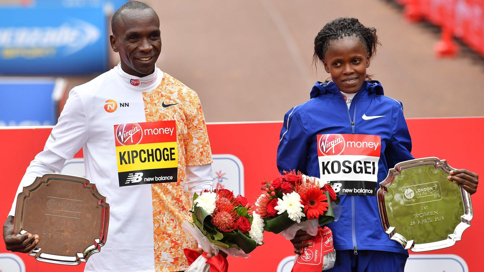 Winners of the elite races at London Marathon 2019 Men's race winner Kenya's Eliud Kipchoge (L) and women's race winner, Kenya's Brigid Kosgei