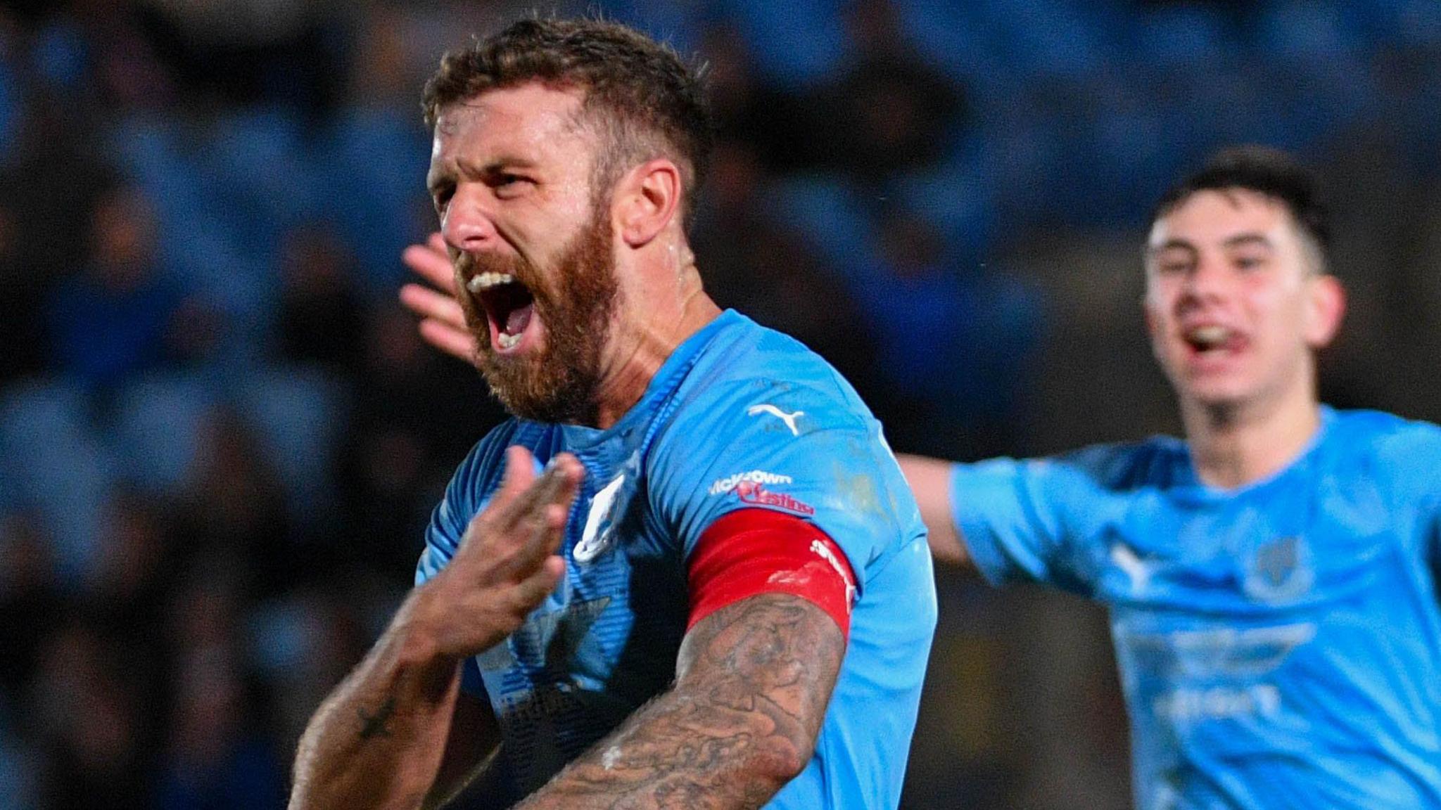 Steven McCullough celebrates scoring Ballymena's opener against Institute