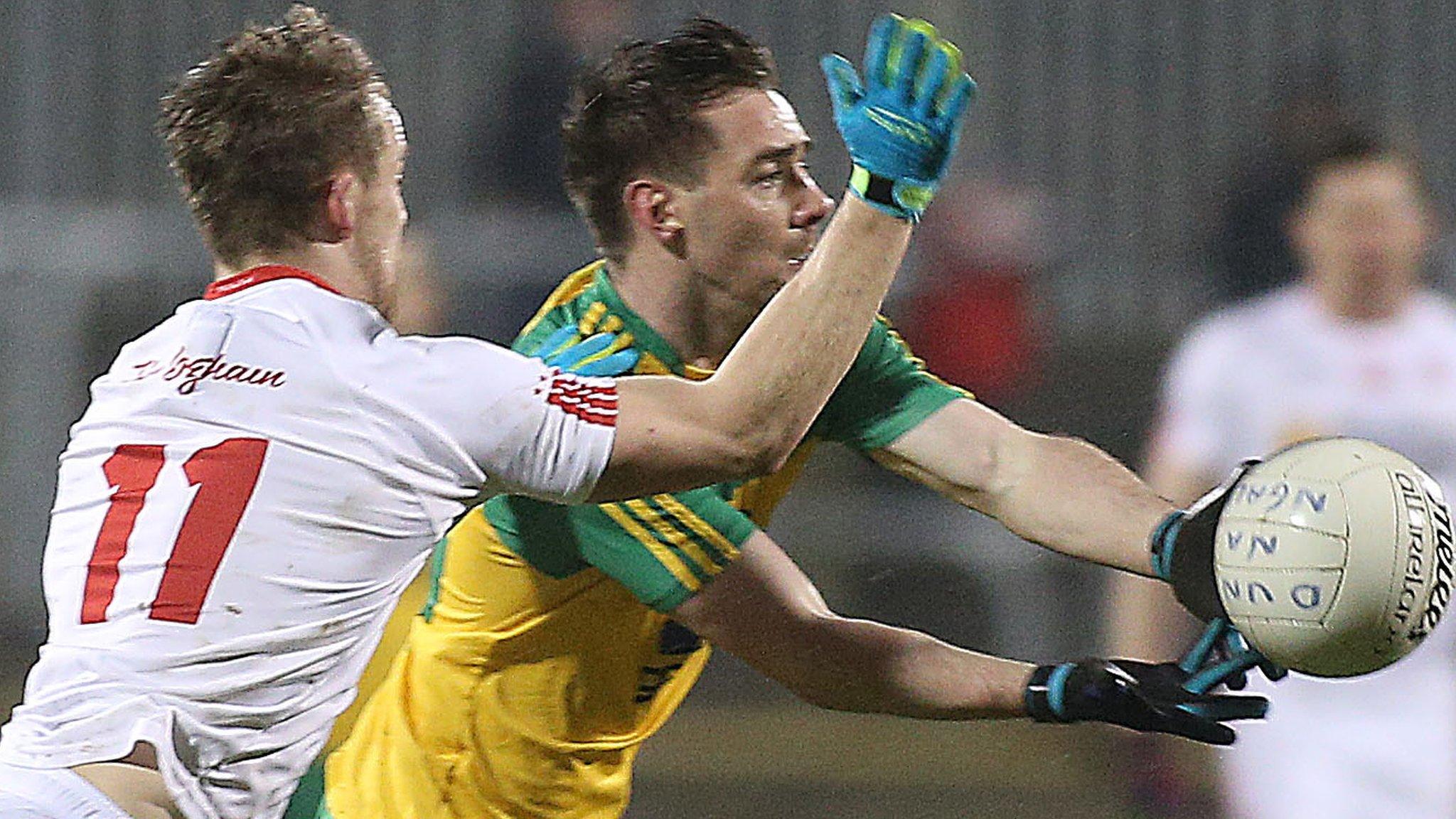 Tyrone forward Kieran McGeary challenges Donegal's Martin O'Reilly