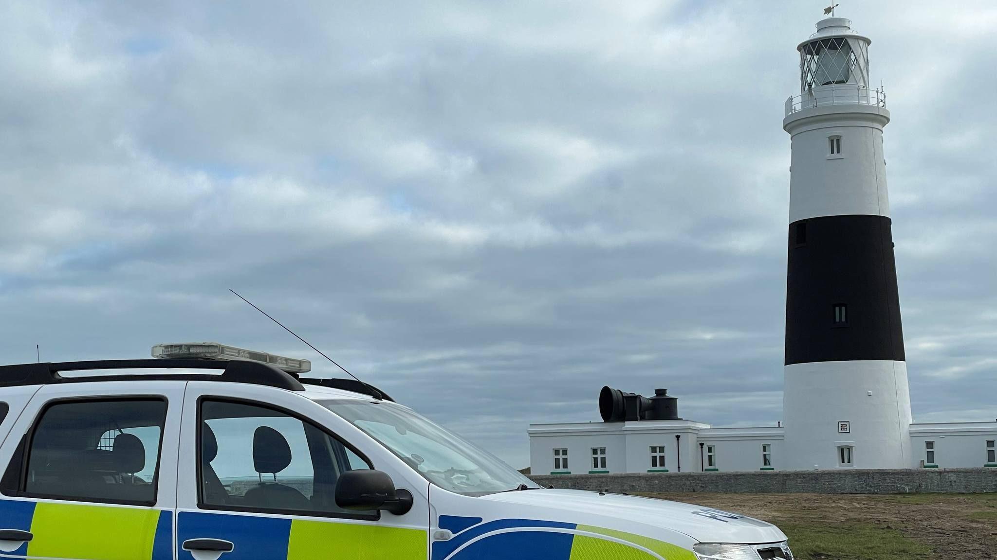 Police car by Alderney lighthouse