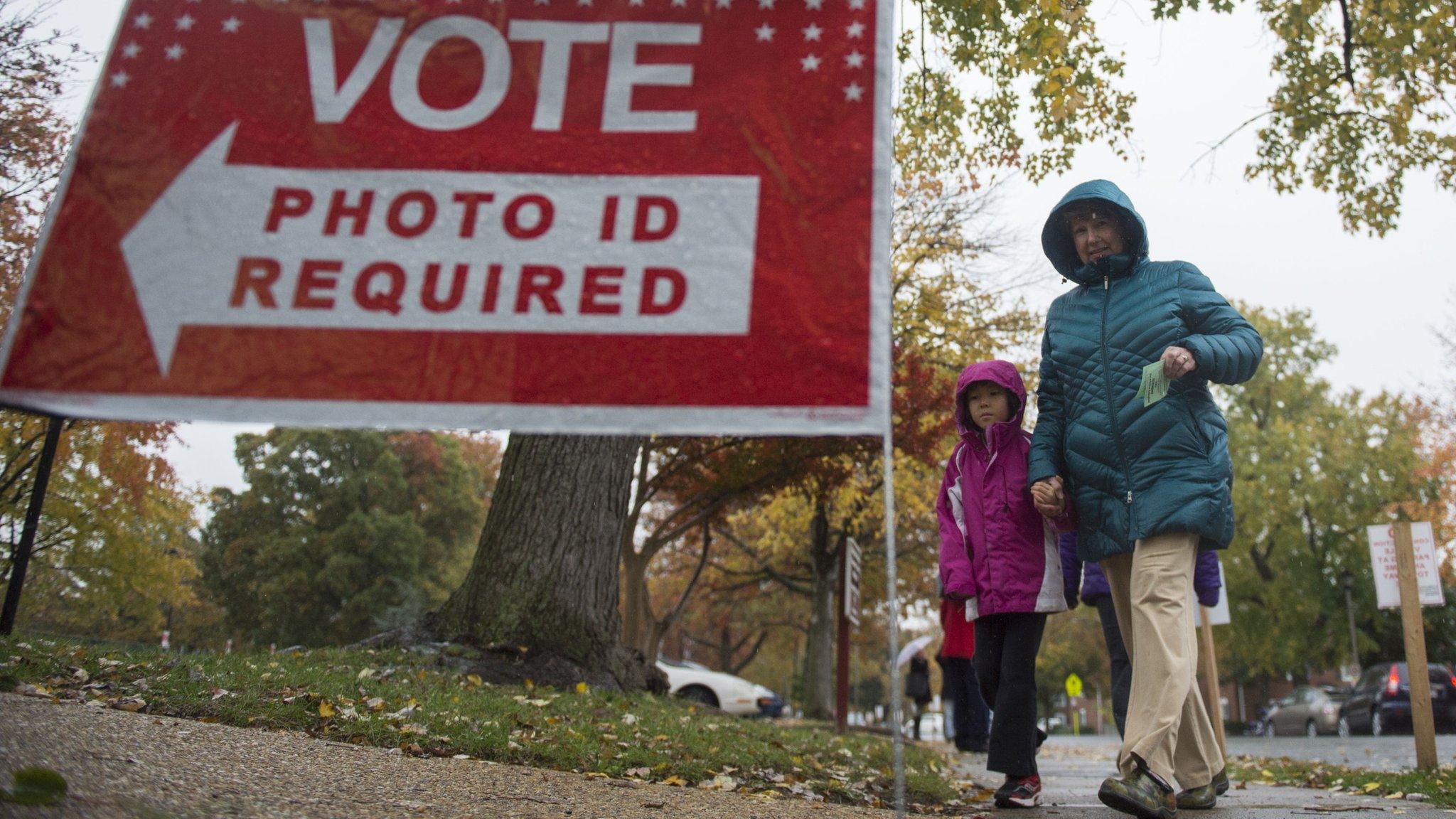 A woman walks to a polling station in Virginia