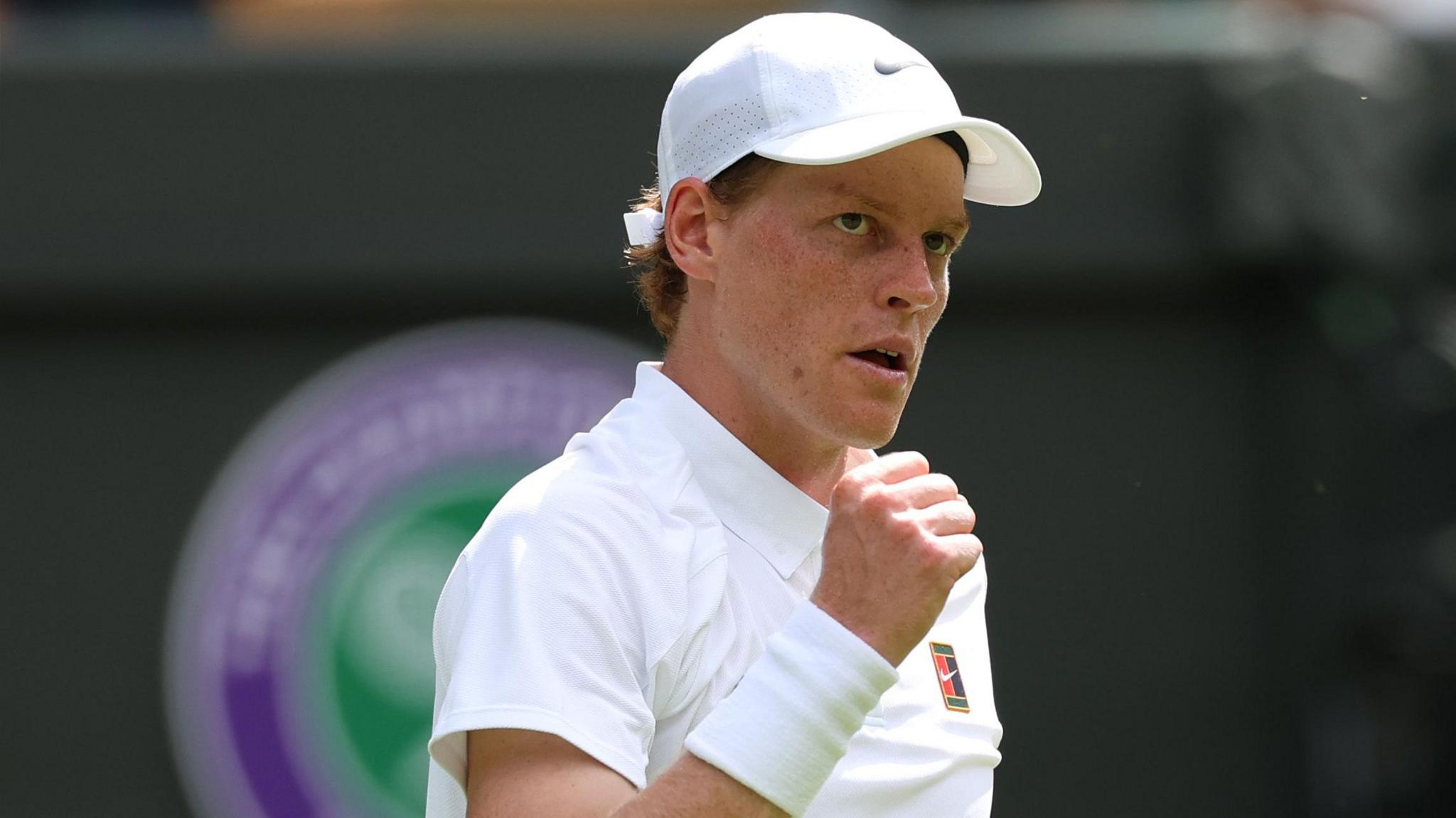 Jannik Sinner celebrates his victory on Court One