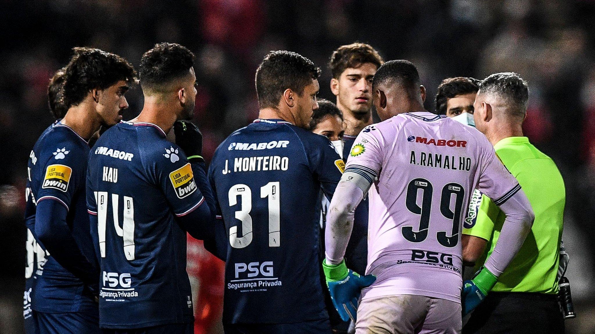 Belenenses players speak to referee