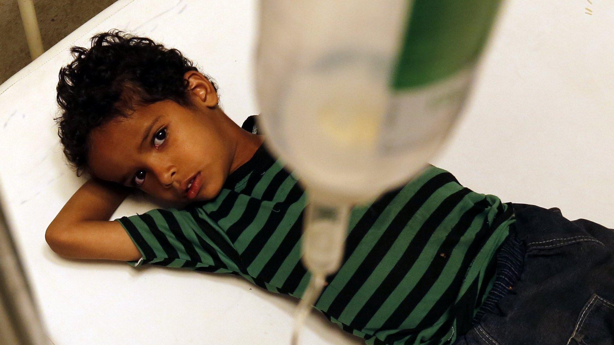 A Yemeni child infected with cholera receives treatment at a hospital in Sanaa (7 August 2017)