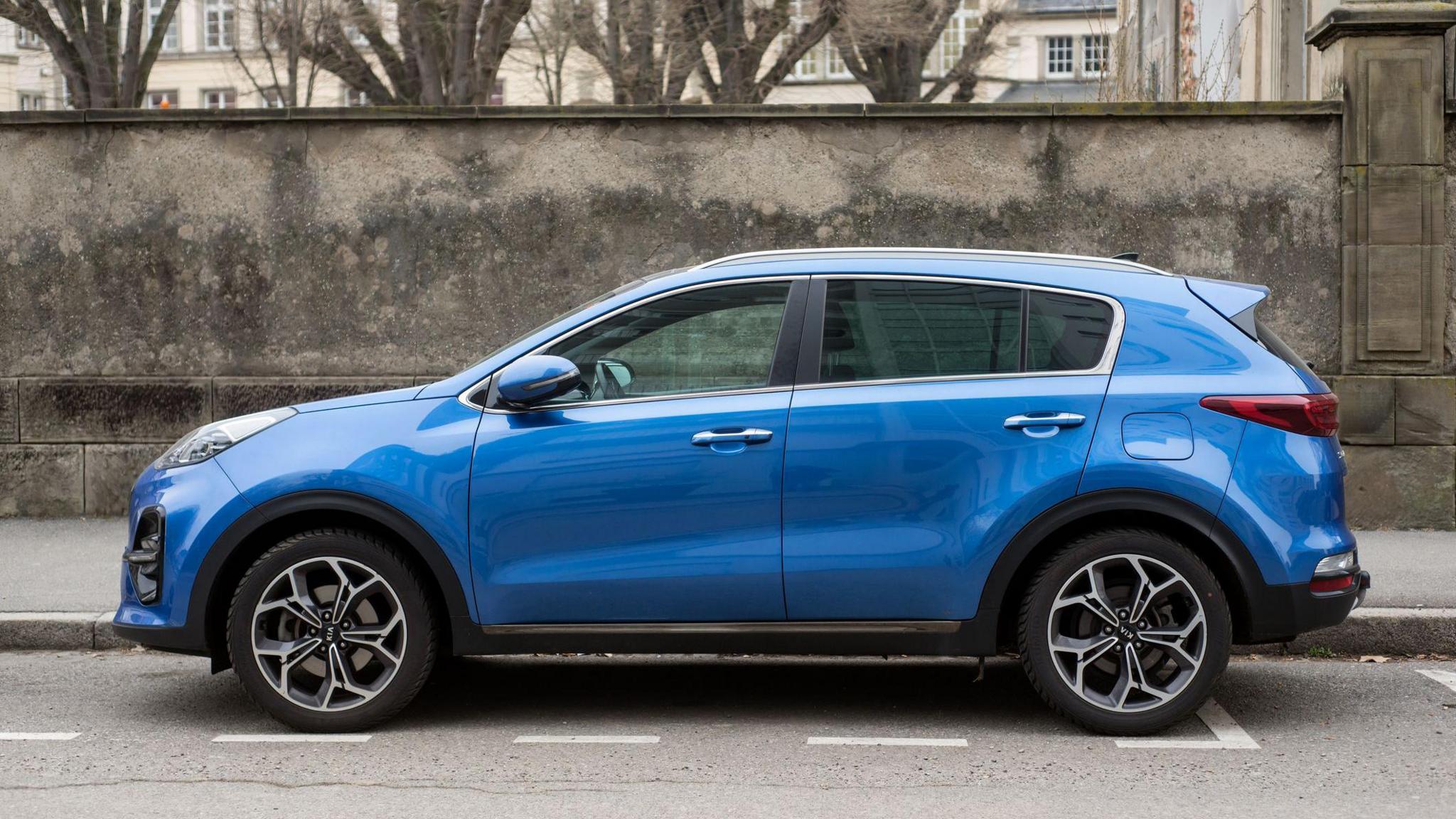 blue car parked on road