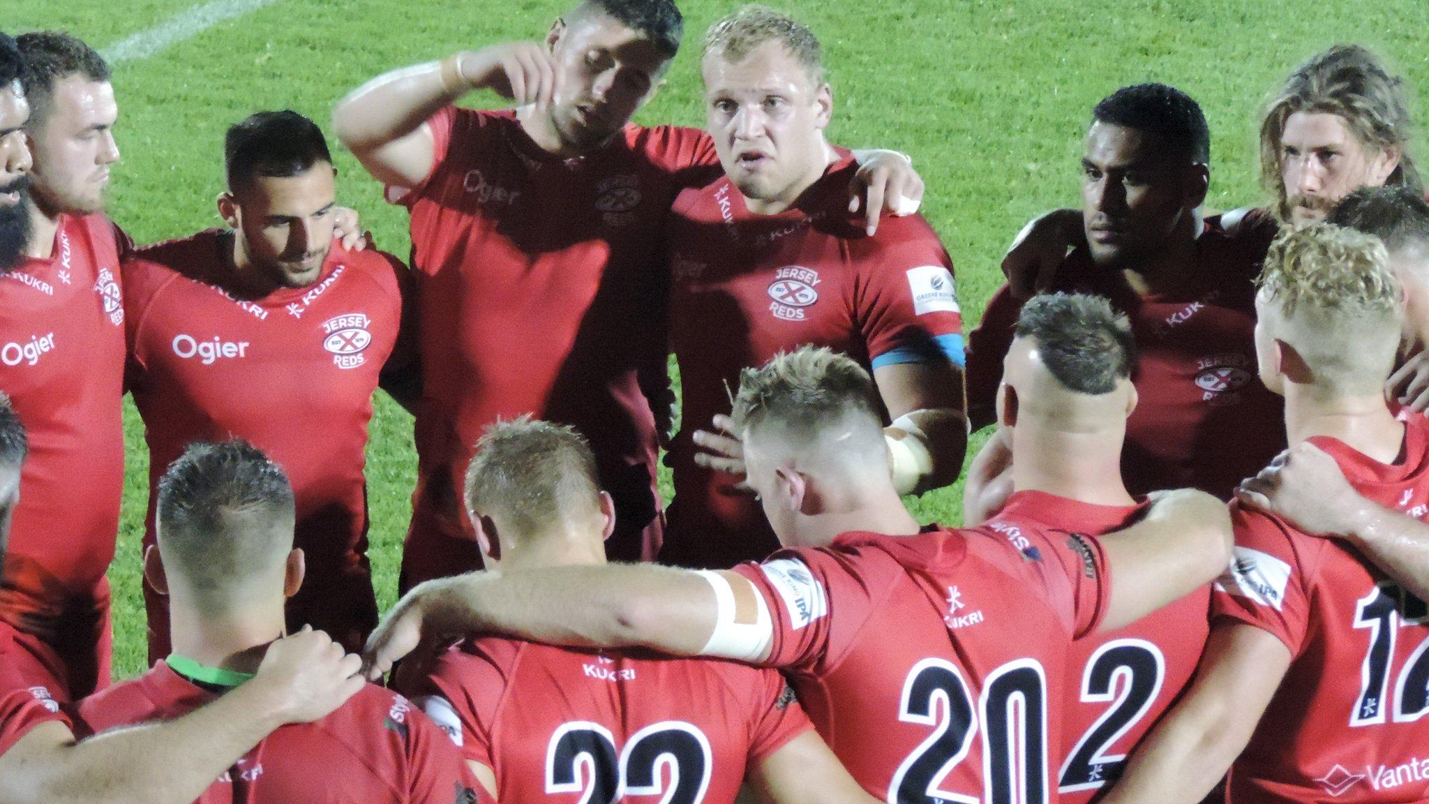 Jersey Reds in team huddle in past match