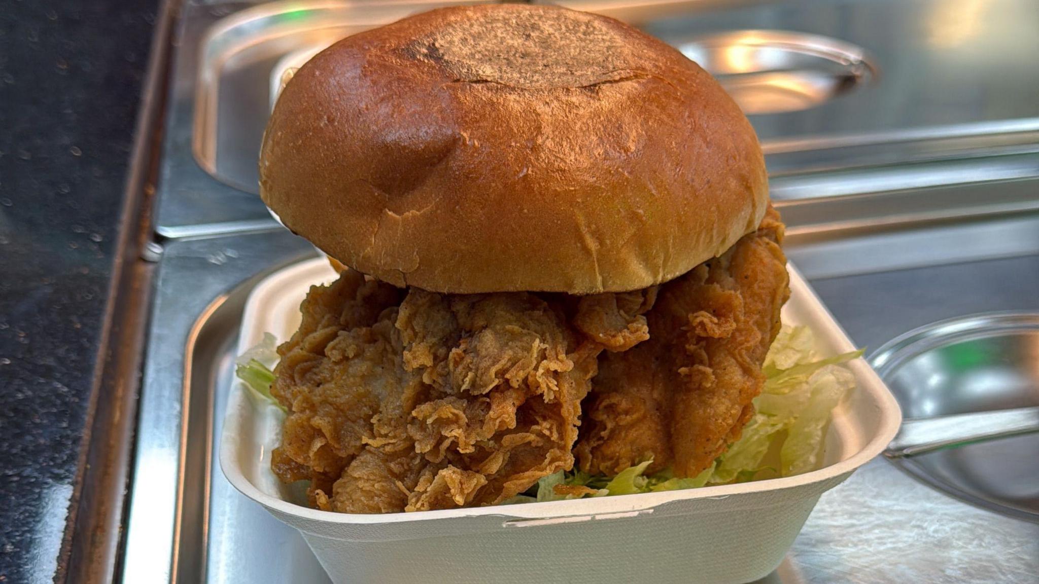 A chicken burger in a brioche bun.