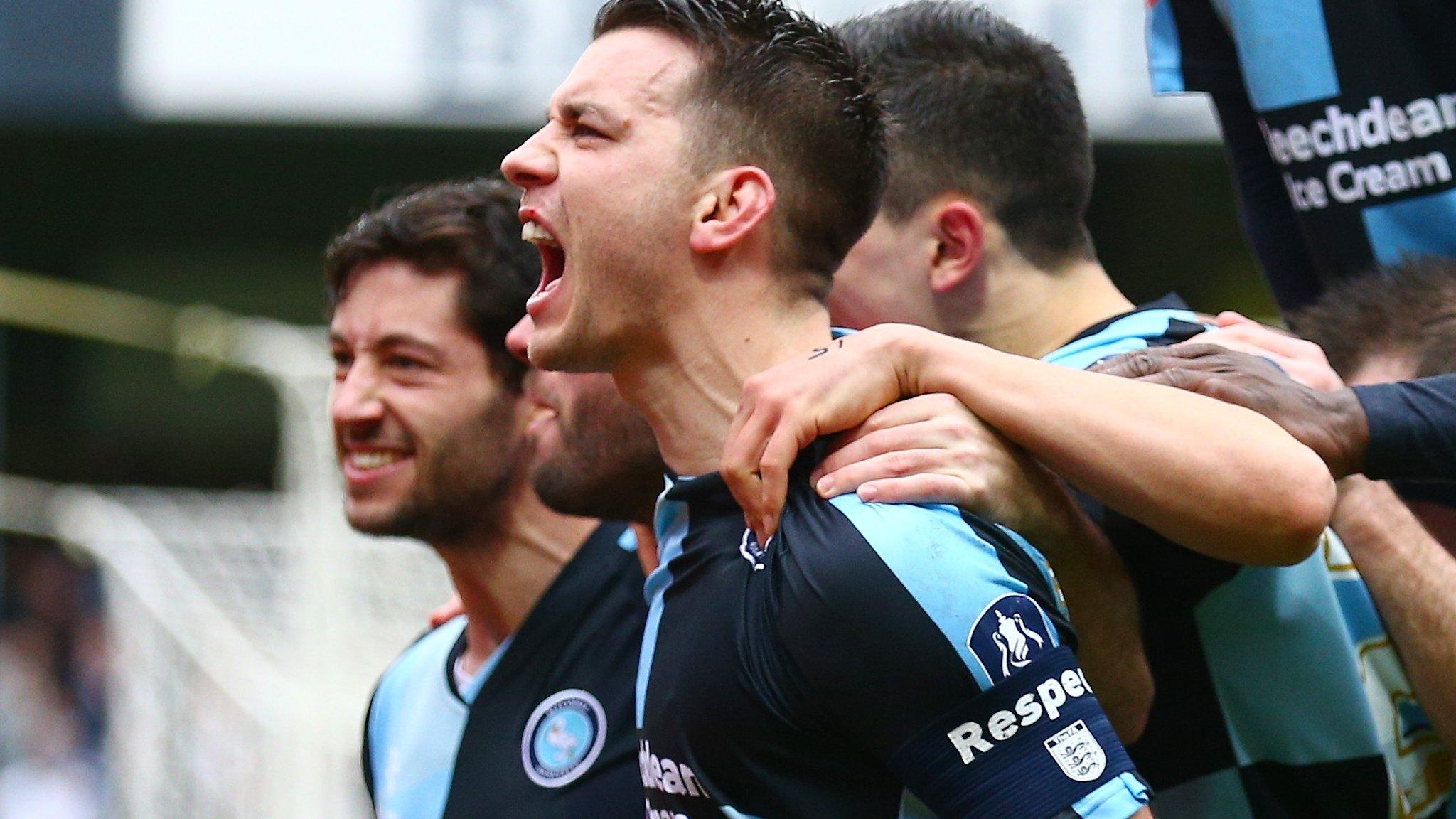 Wycombe players celebrate scoring