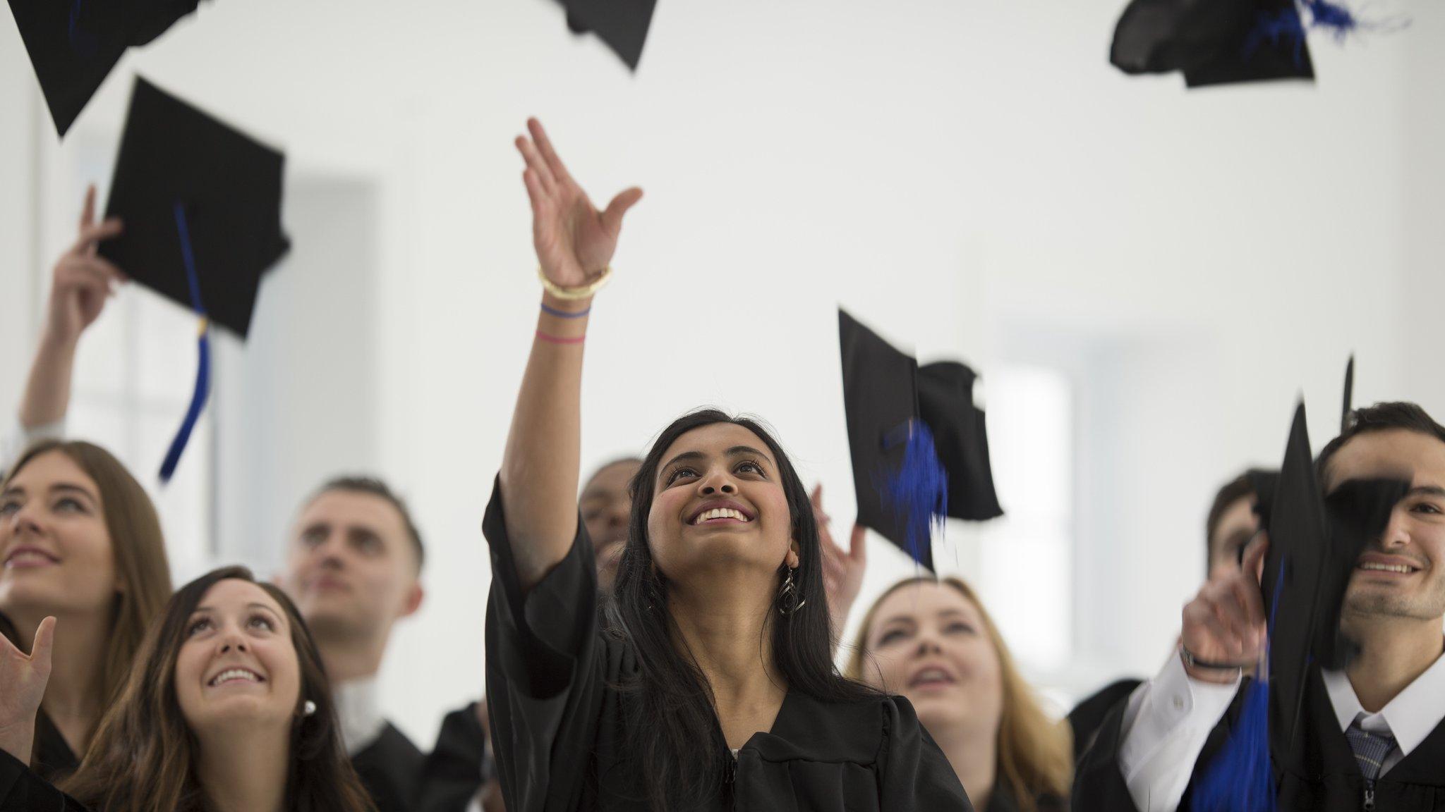 Group of students celebrating after graduation