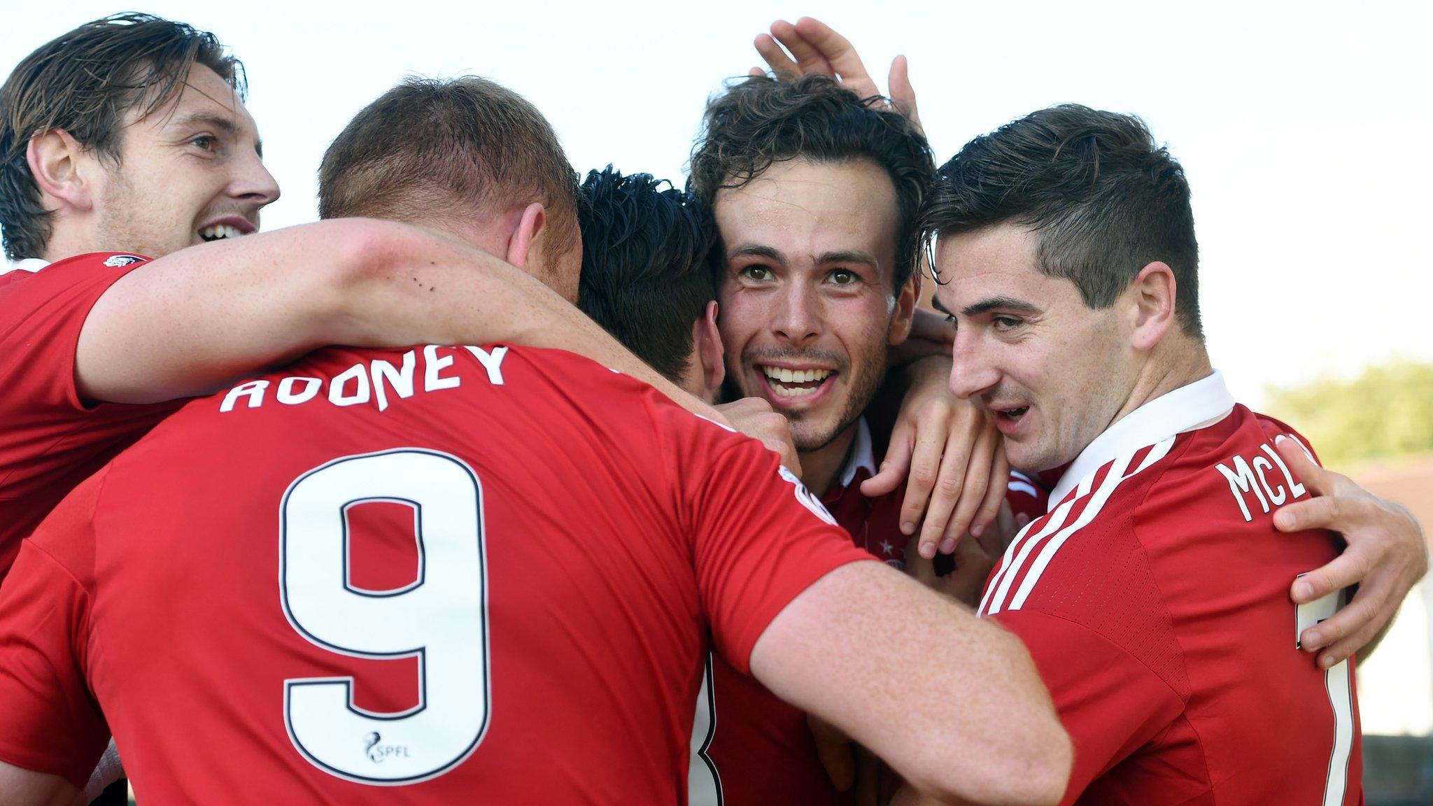 Aberdeen celebrate Andrew Considine's goal early in the second half