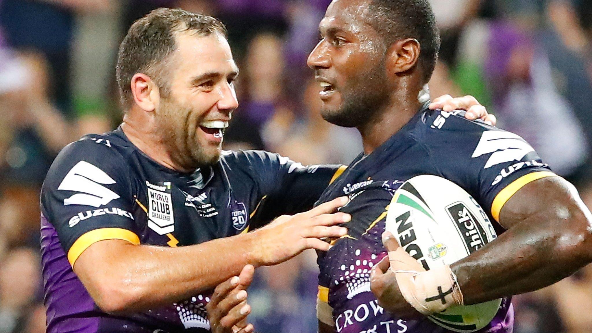 Melbourne Storm celebrate a try v Leeds Rhinos