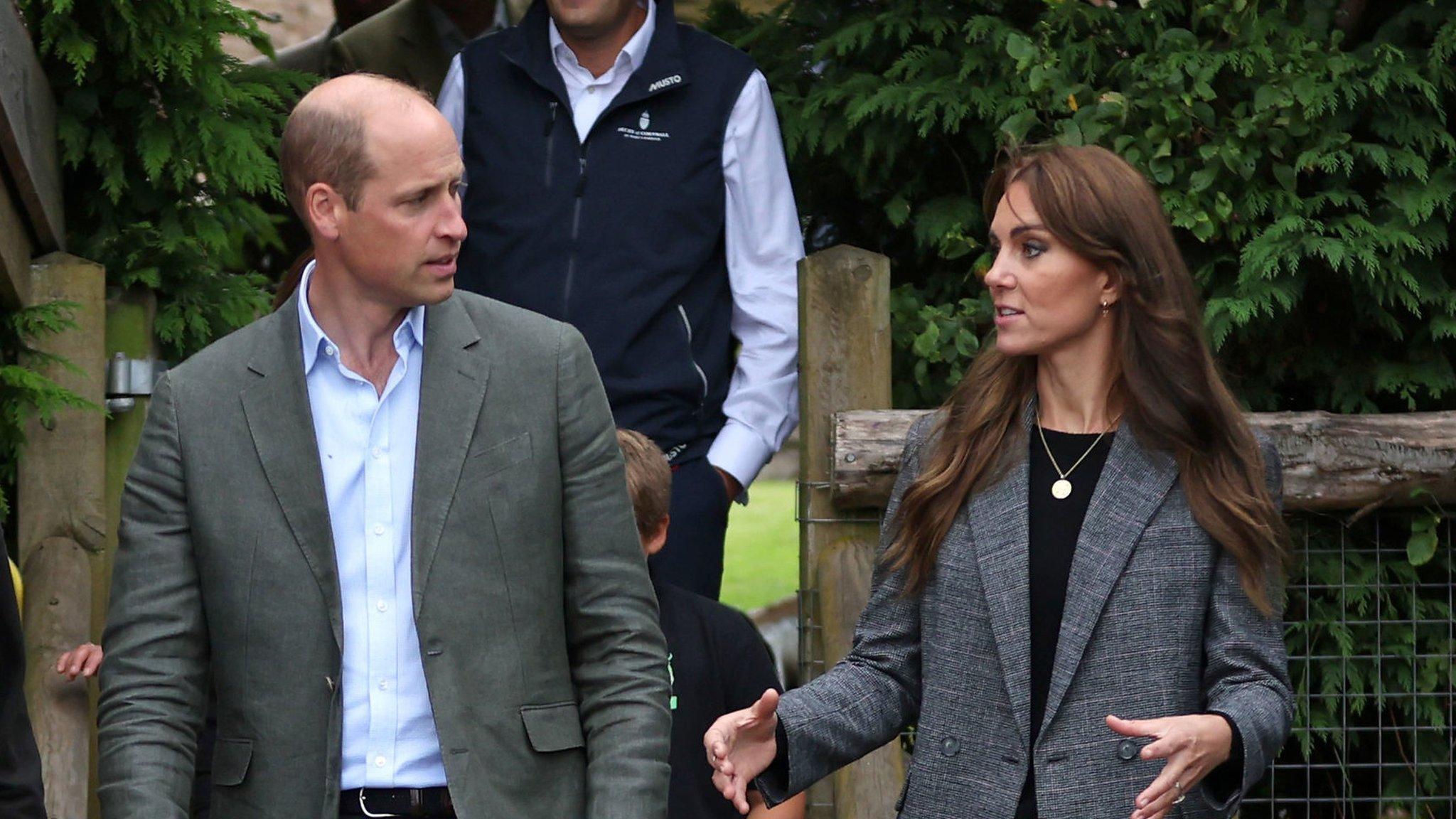 The Prince and Princess of Wales speaking while standing next to each other