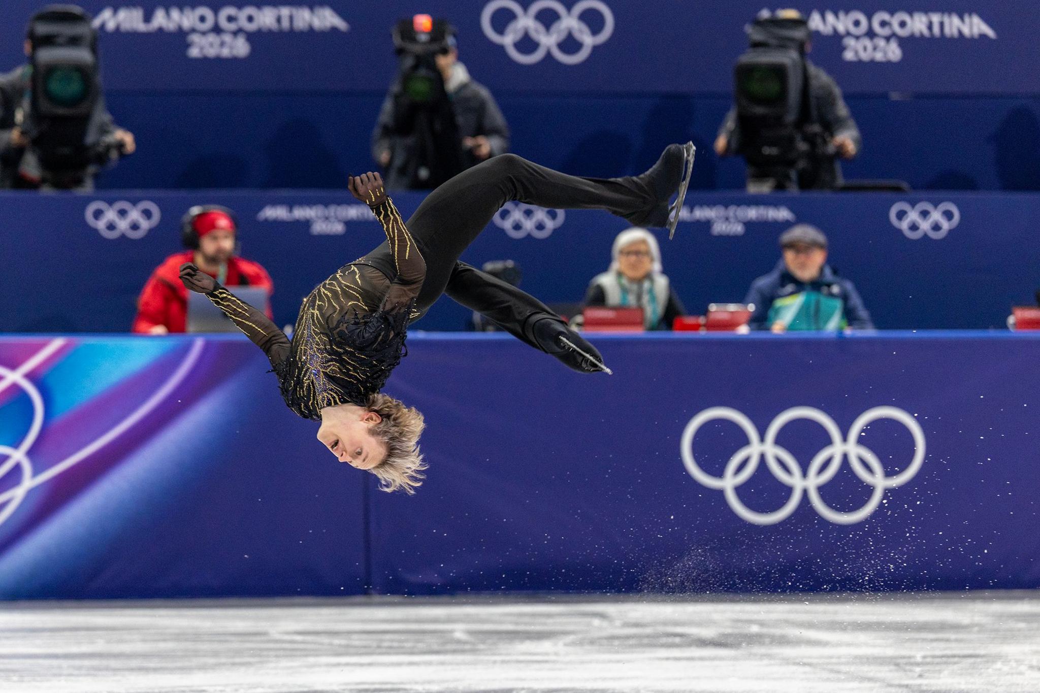 The USA's Ilia Malinin performs a somersault during his routine in the figure skating team event