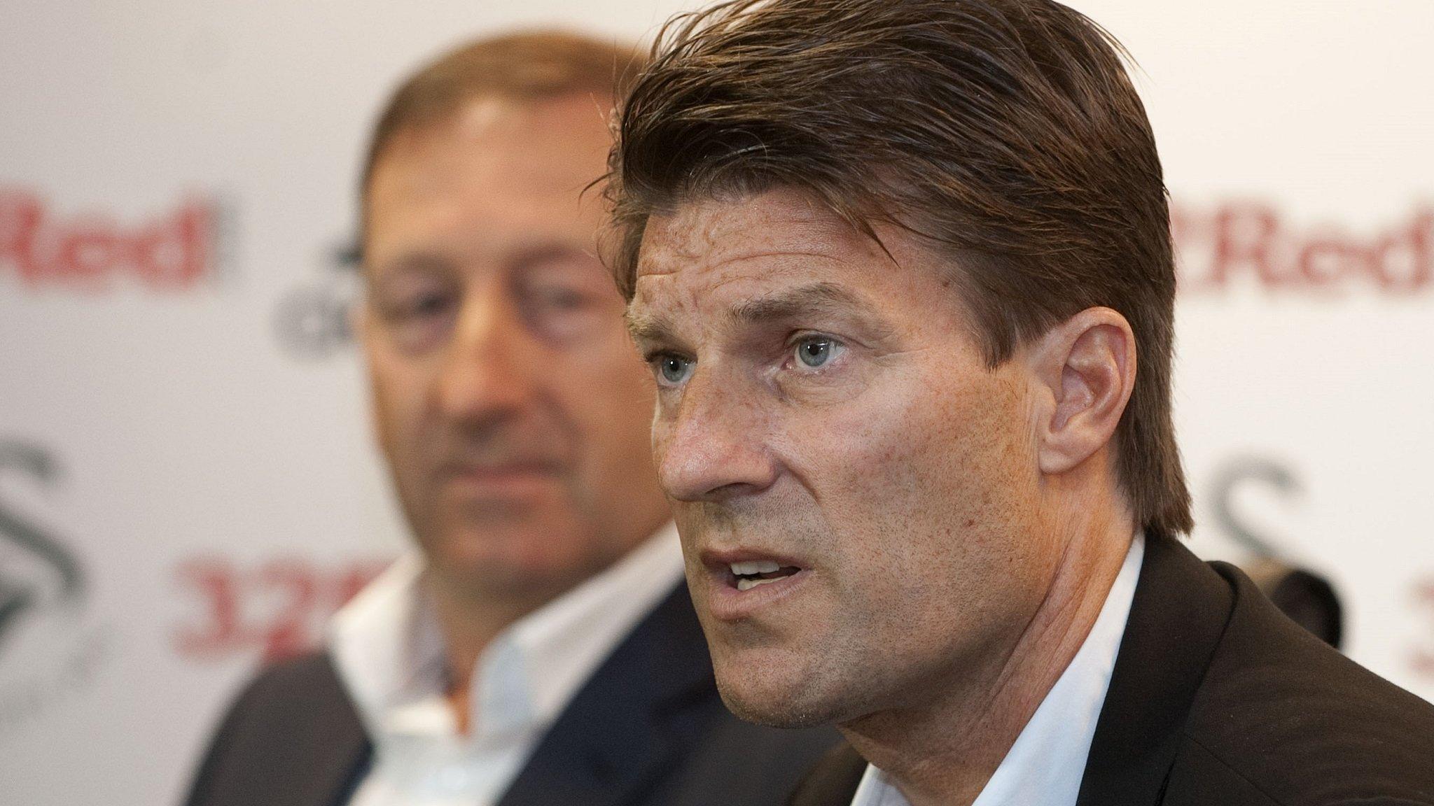 Michael Laudrup at his first media conference with Swansea City watched by club chairman Huw Jenkins