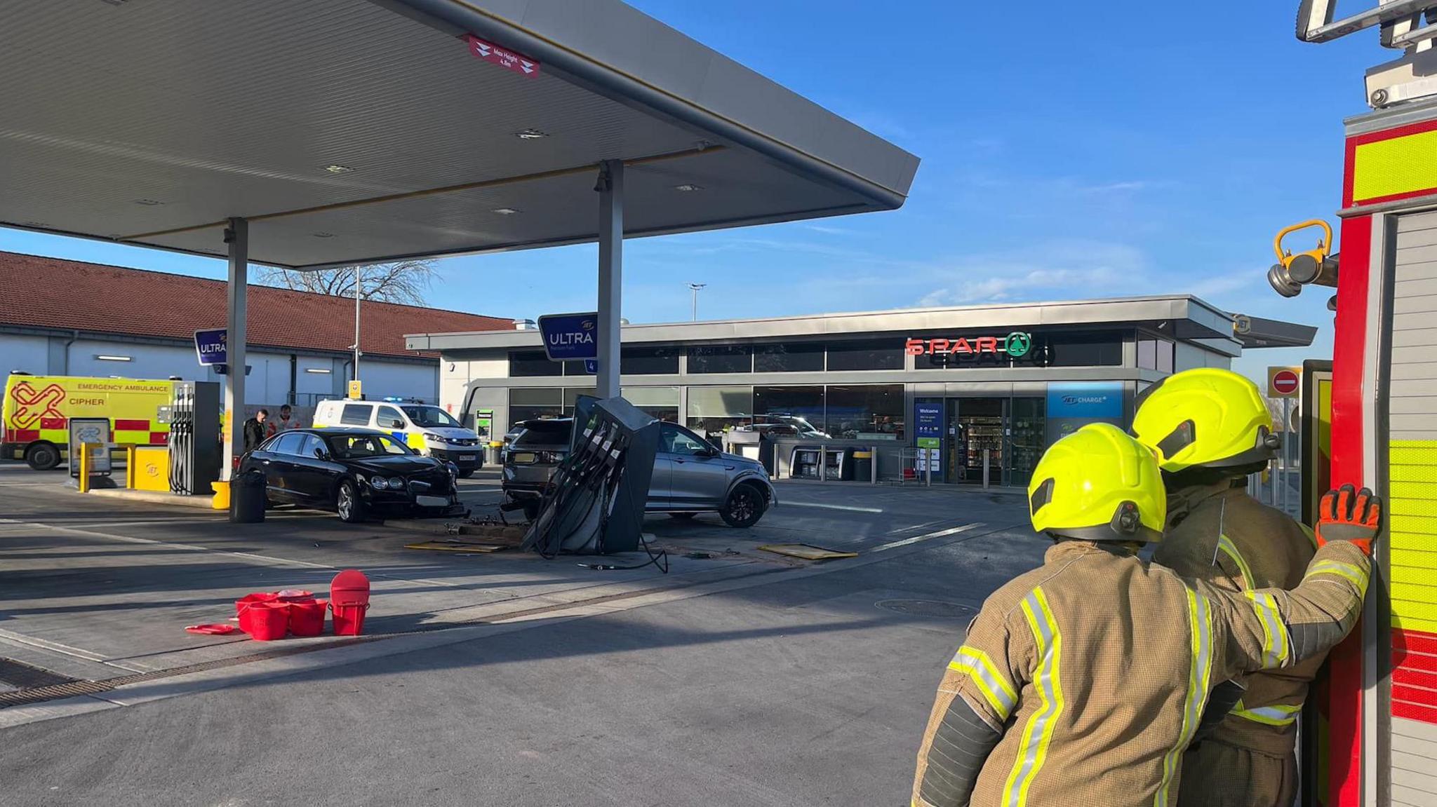 jet garage at Colburn  with a damaged pump and two cars