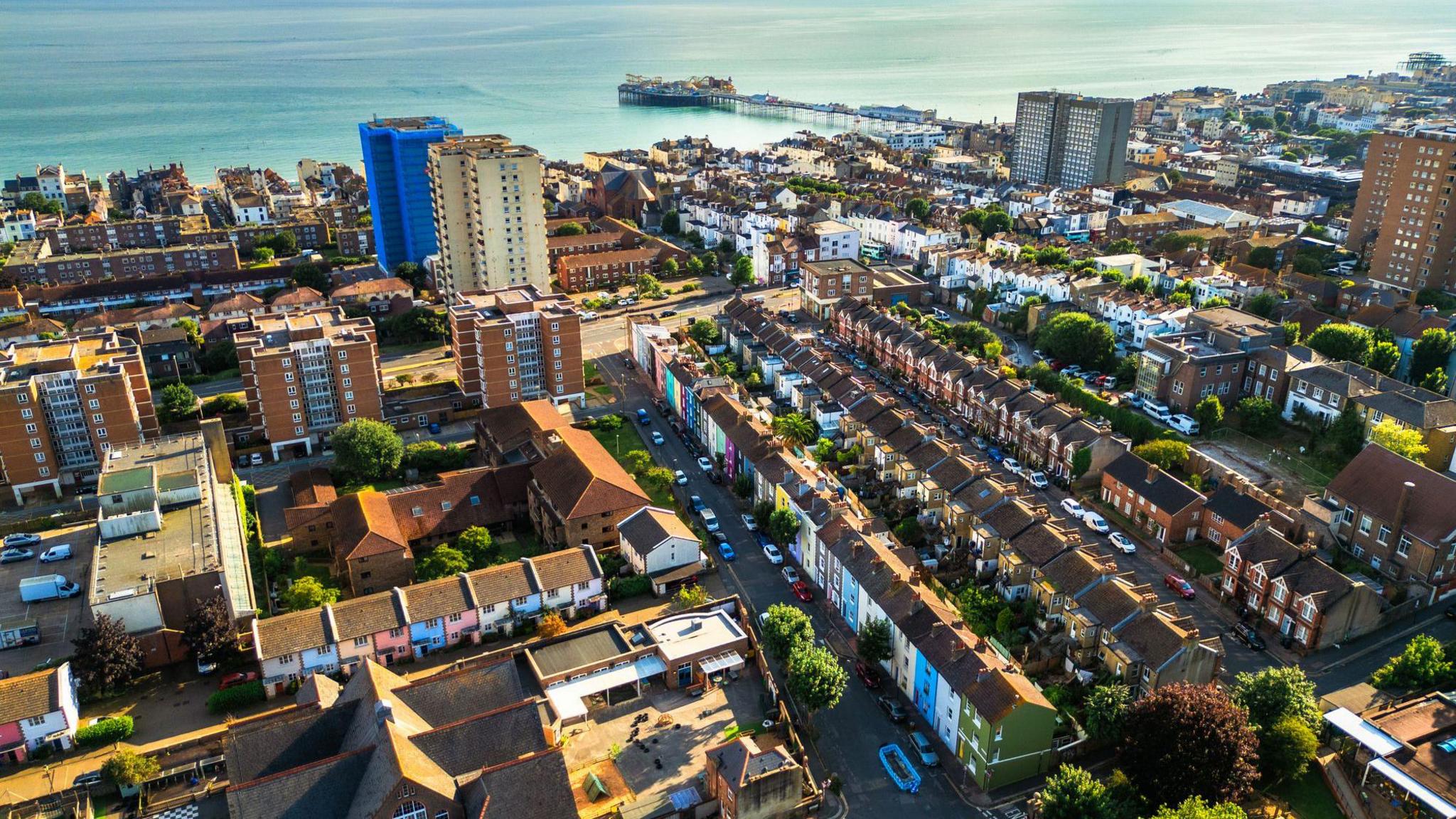 Aerial view, taken by drone, depicting the architecture and housing of Brighton in East Sussex, UK on a sunny summer day.