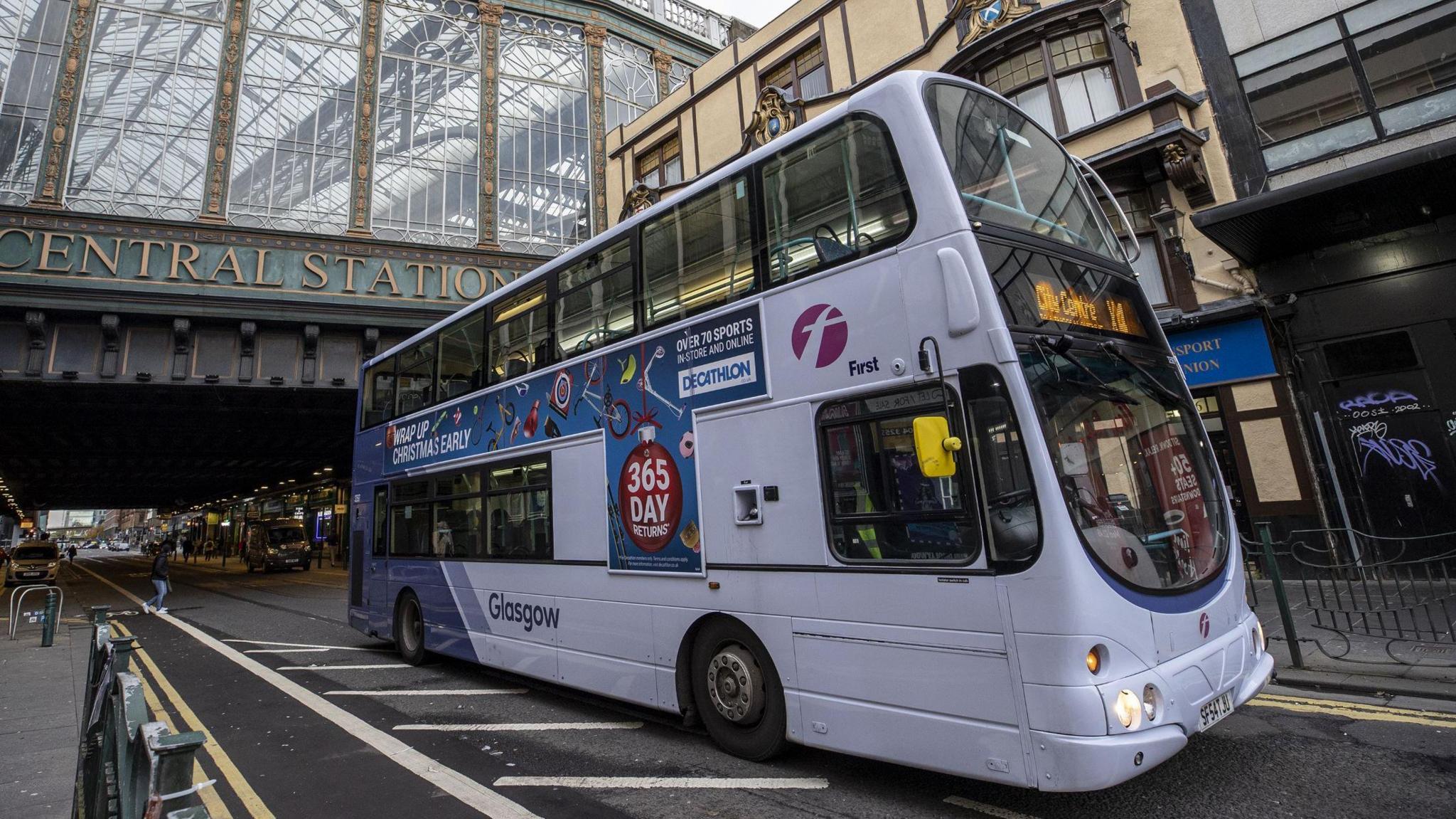 A bus travels underneath the bridge at Glasgow Central train station