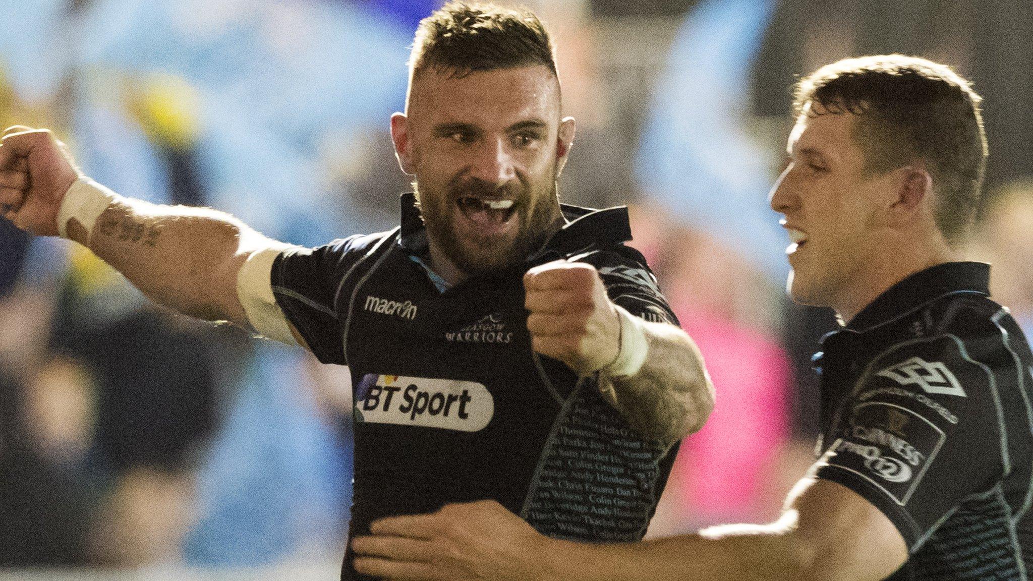 Rory Hughes (left) celebrates with Glasgow Warriors