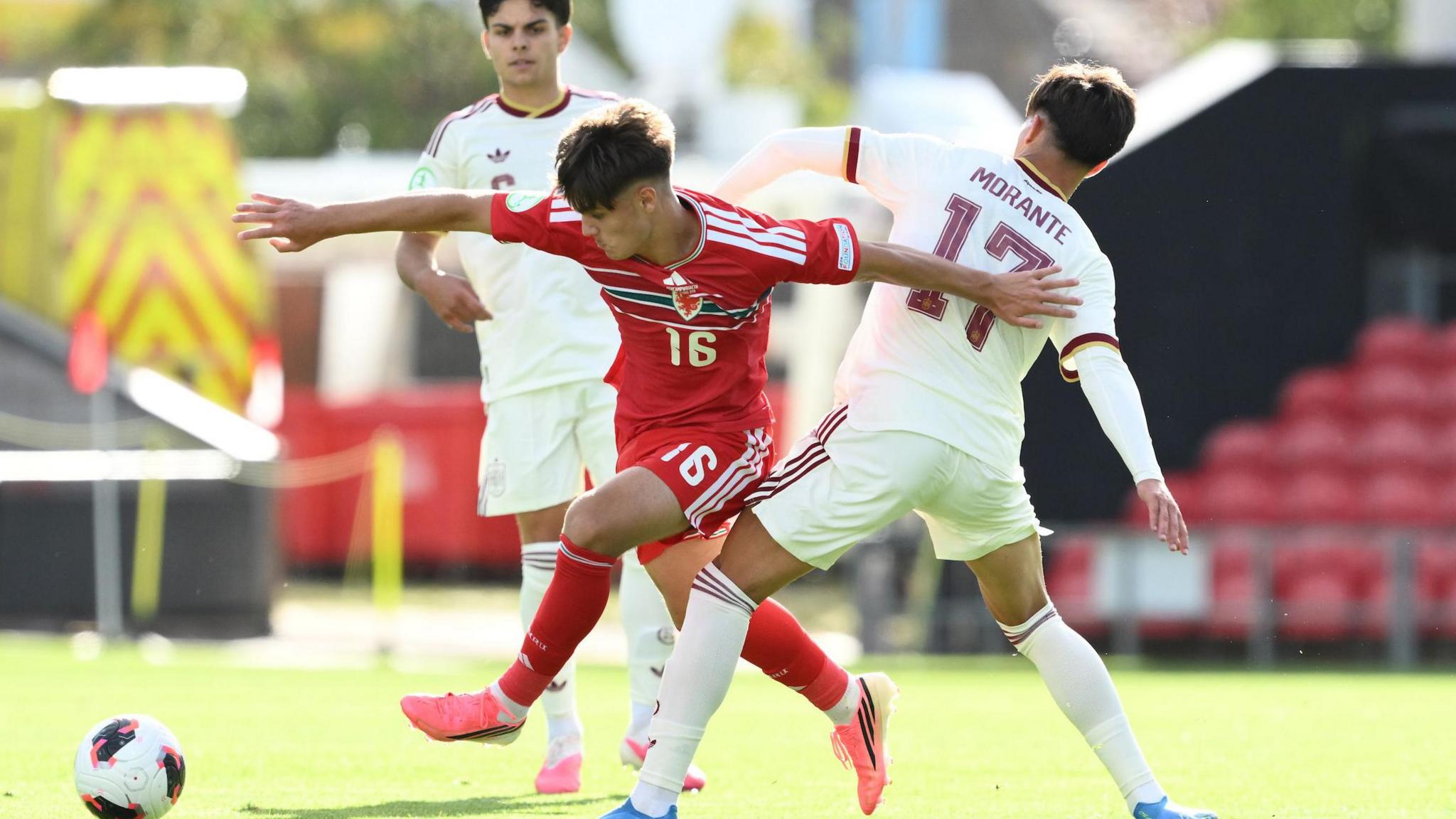 Robert Tankiewicz of Wales evades the challenge of Spain's Jose Antonio Morante