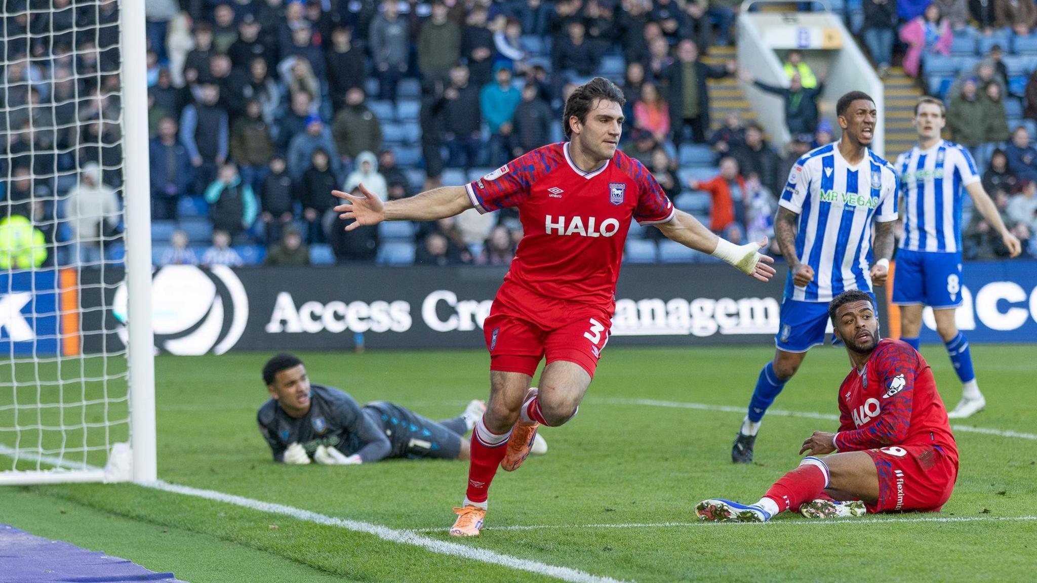 Spaniard Ivan Azon wheels away in delight with his arms outstretched after giving Ipswich the lead in their win at Sheffield Wednesday.