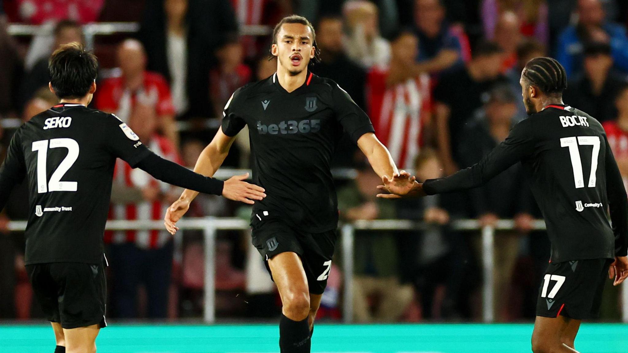 Ashley Phillips is congratulated by his team-mates after his League Cup strike at Southampton