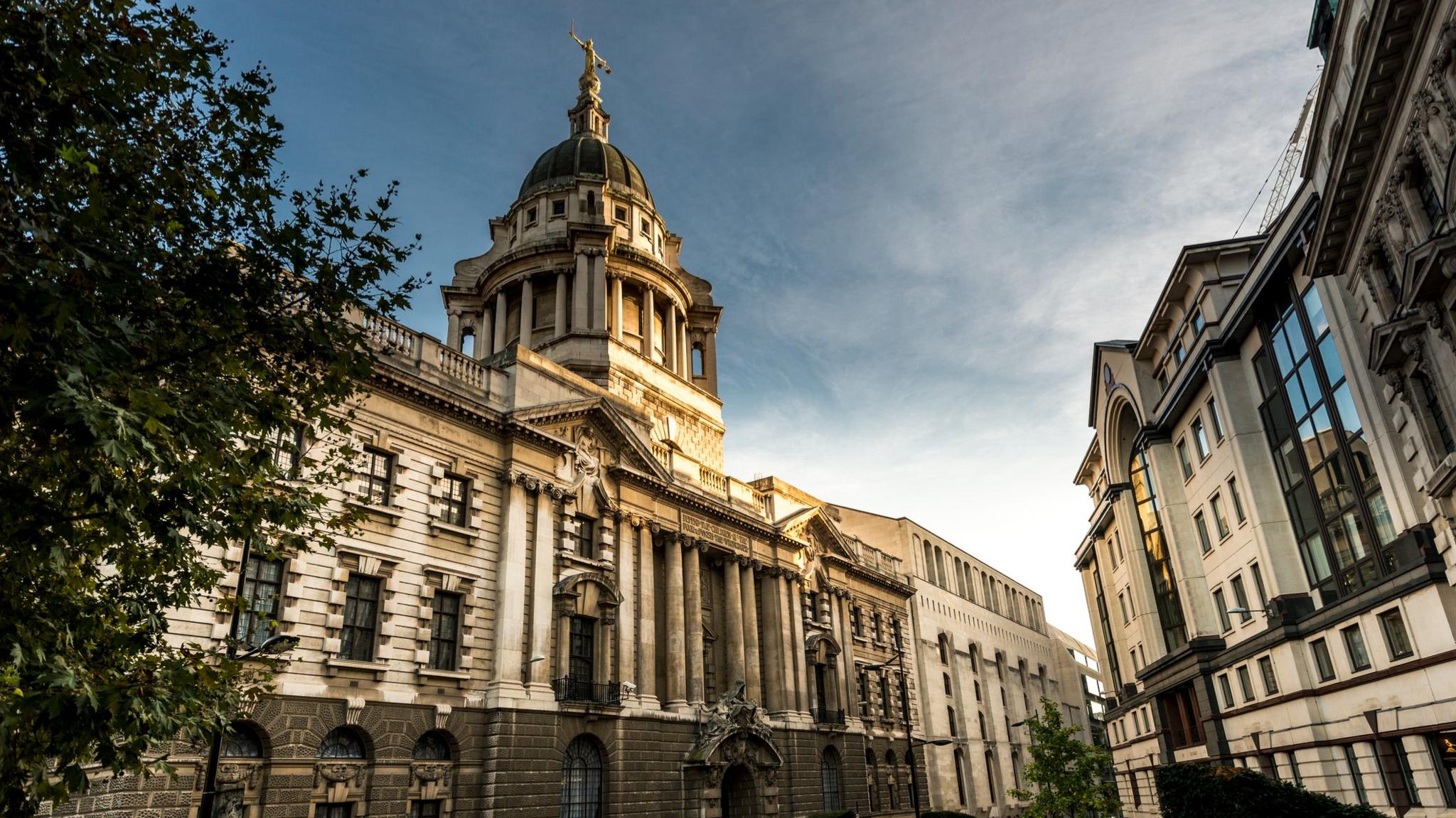 The Central Criminal Court of England and Wales known as the Old Bailey from the street on which it.